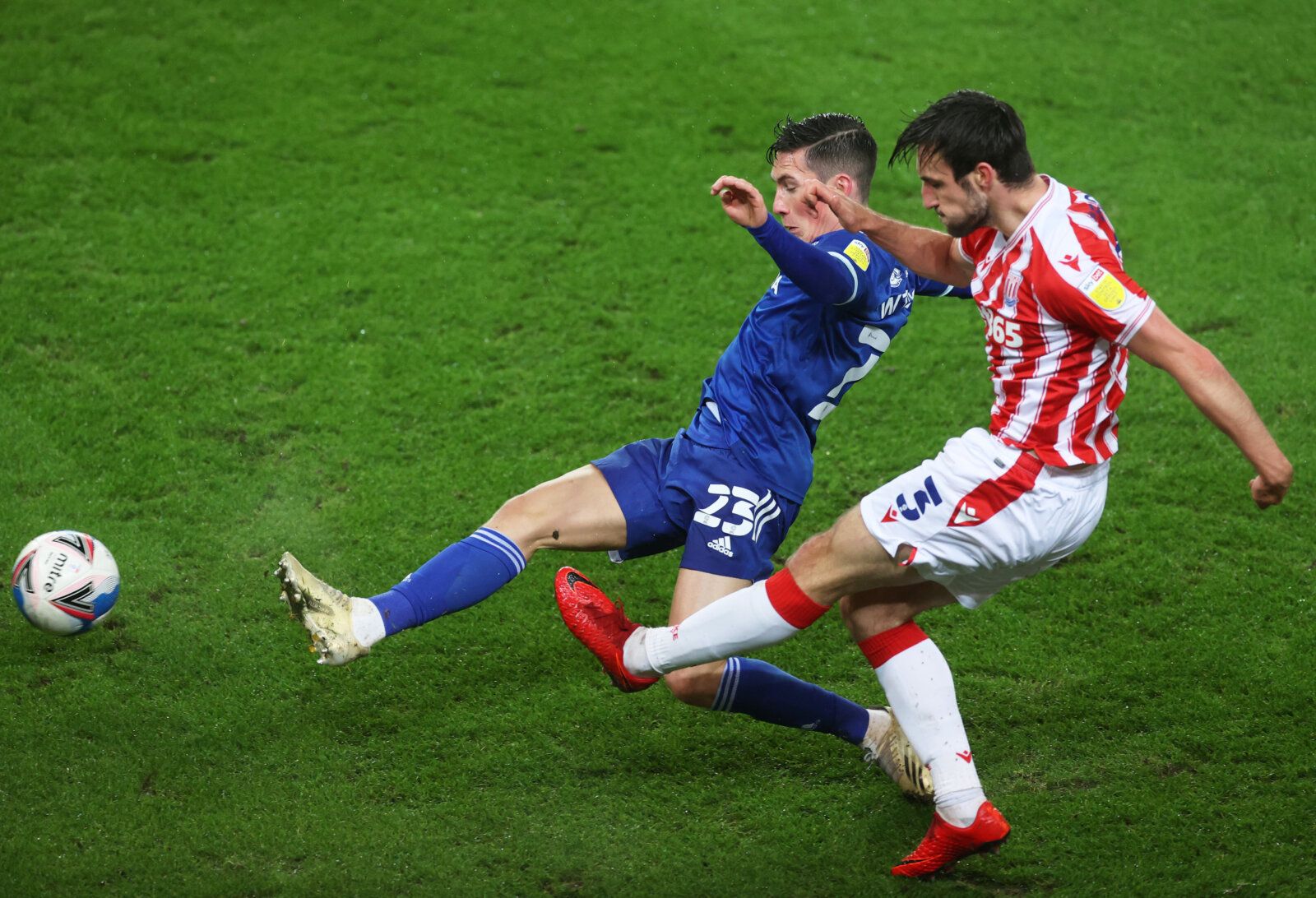 Soccer Football - Championship - Stoke City v Cardiff City - bet365 Stadium, Stoke-on-Trent, Britain - December 8, 2020 Stoke City's Morgan Fox in action with Cardiff City's Harry Wilson Action Images/Carl Recine EDITORIAL USE ONLY. No use with unauthorized audio, video, data, fixture lists, club/league logos or 'live' services. Online in-match use limited to 75 images, no video emulation. No use in betting, games or single club /league/player publications.  Please contact your account represent