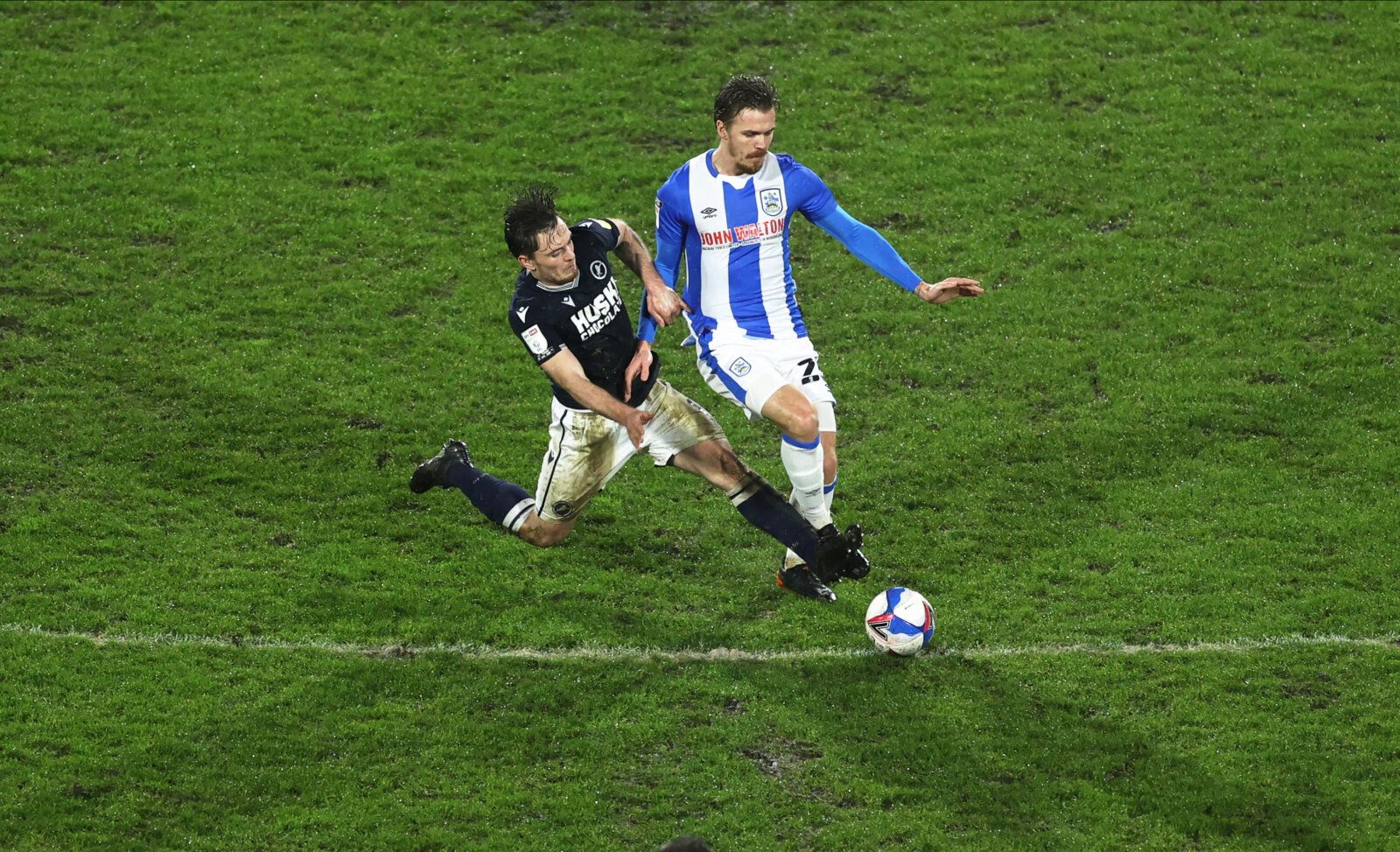 Soccer Football - Championship - Huddersfield Town v Millwall - John Smith's Stadium, Huddersfield, Britain - January 20, 2021  Huddersfield Town's Daniel Ward in action with Millwall's Ben Thompson Action Images/Lee Smith EDITORIAL USE ONLY. No use with unauthorized audio, video, data, fixture lists, club/league logos or 'live' services. Online in-match use limited to 75 images, no video emulation. No use in betting, games or single club /league/player publications.  Please contact your account