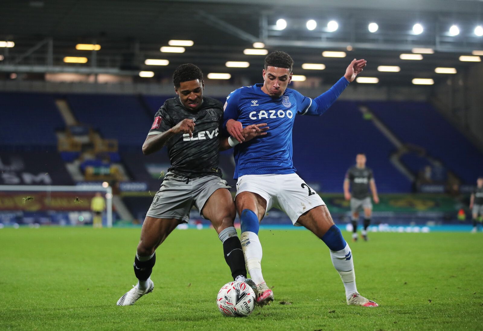 Soccer Football - FA Cup - Fourth Round - Everton v Sheffield Wednesday - Goodison Park, Liverpool, Britain - January 24, 2021 Sheffield Wednesday's Kadeem Harris in action with Everton's Ben Godfrey Action Images via Reuters/Molly Darlington