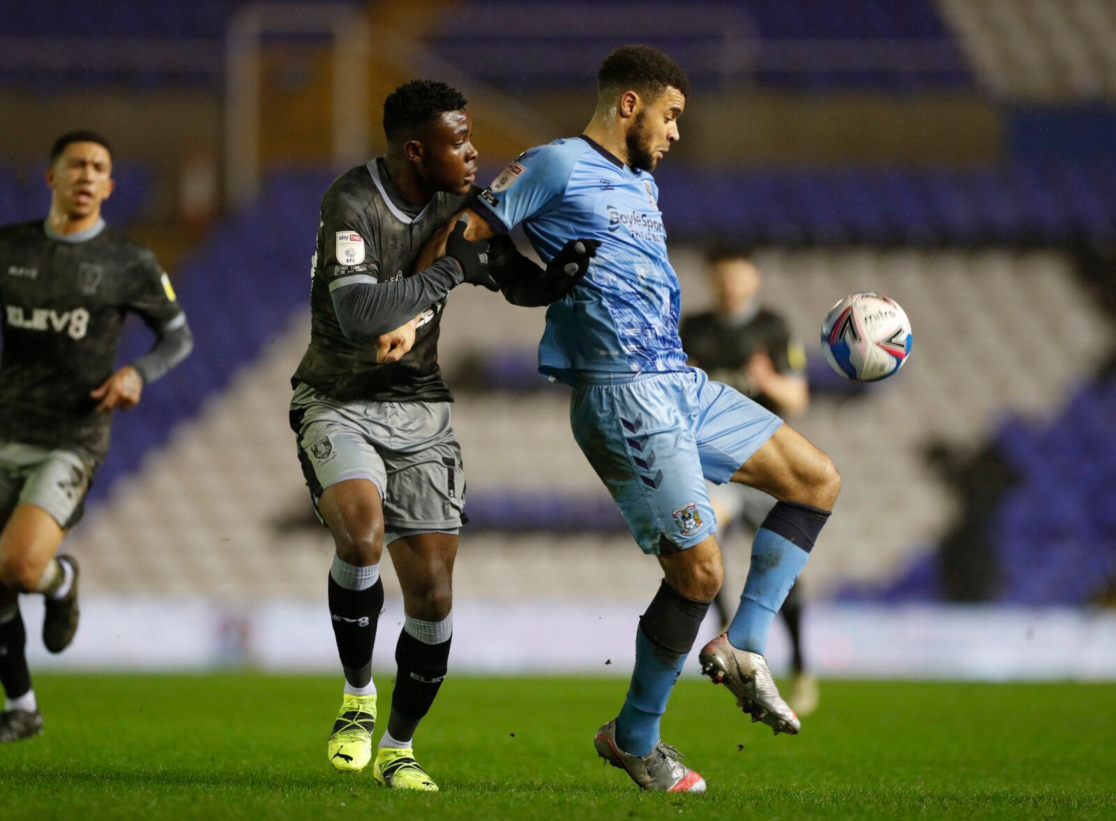 Soccer Football - Championship - Coventry City v Sheffield Wednesday - St Andrew's, Birmingham, Britain - January 27, 2021  Coventry City's Max Biamou in action with Sheffield Wednesday's Fisayo Dele-Bashiru Action Images/Paul Childs