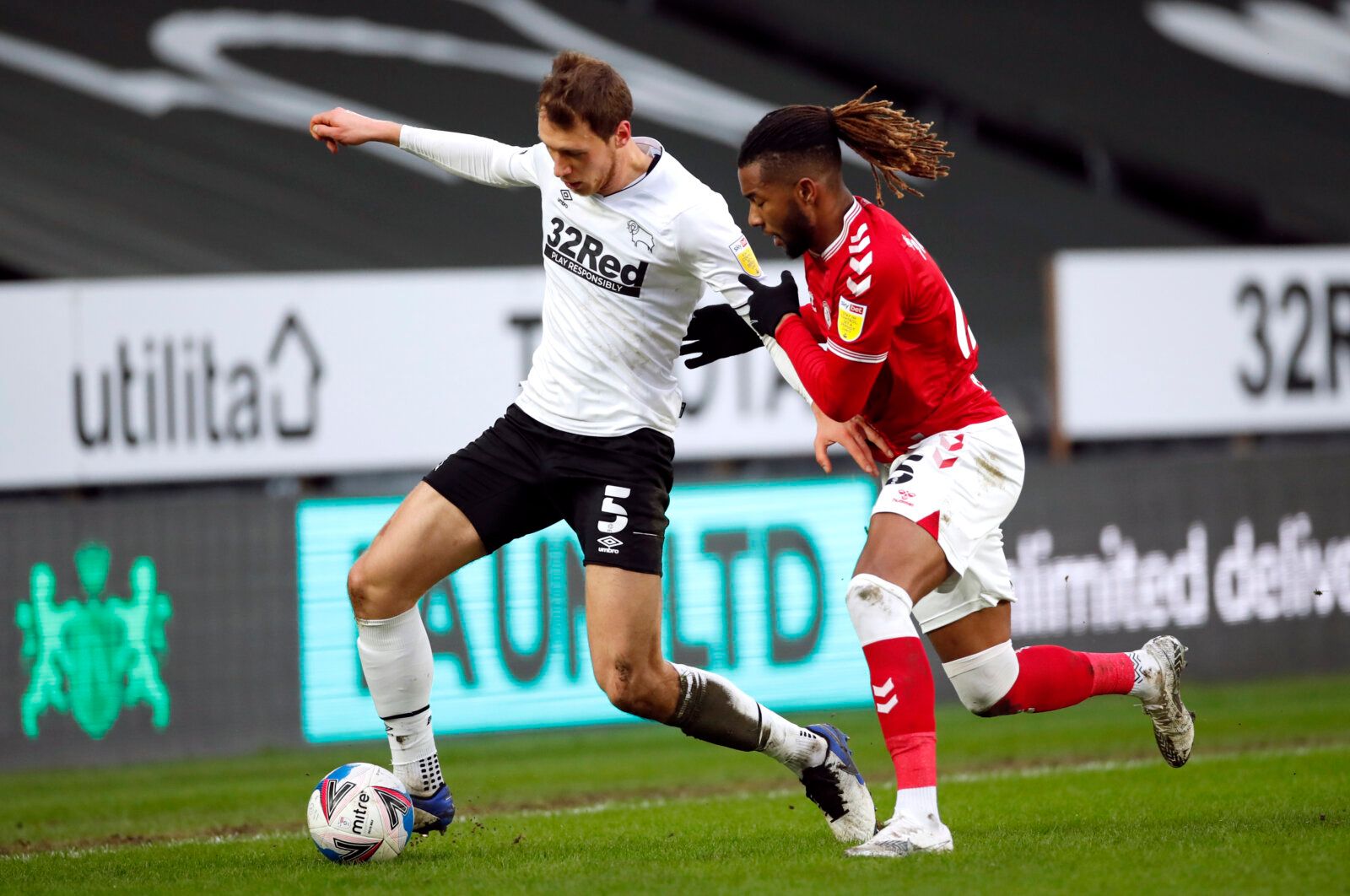 Soccer Football - Championship - Derby County v Bristol City - Pride Park, Derby, Britain - January 30, 2021 Derby County's Krystian Bielik in action with Bristol City's Kasey Palmer Action Images/Andrew Boyers EDITORIAL USE ONLY. No use with unauthorized audio, video, data, fixture lists, club/league logos or 'live' services. Online in-match use limited to 75 images, no video emulation. No use in betting, games or single club /league/player publications.  Please contact your account representat