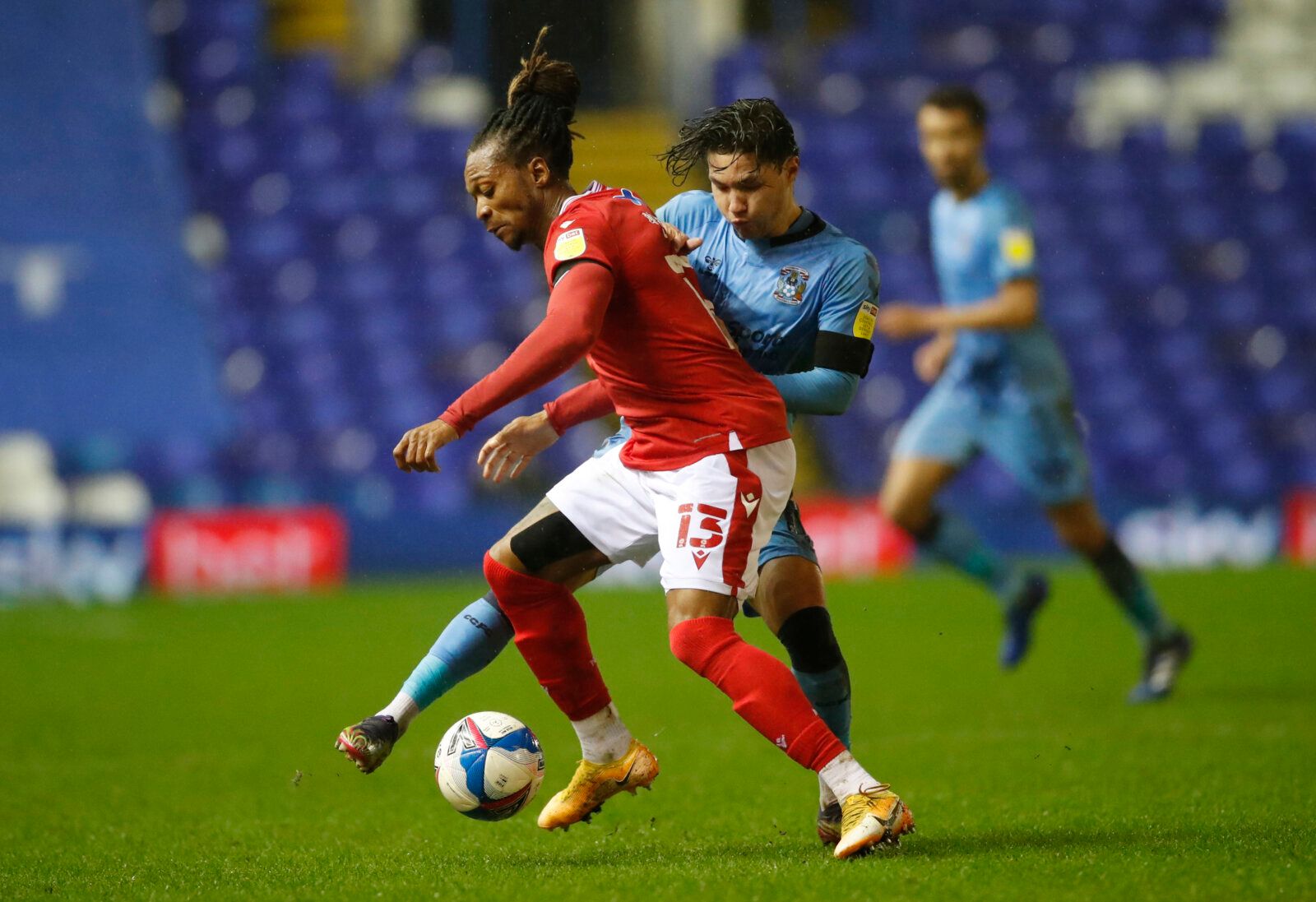 Soccer Football - Championship - Coventry City v Nottingham Forest - St Andrew's, Birmingham, Britain - February 2, 2021 Nottingham Forest's Gaetan Bong in action with Coventry City's Callum O'Hare Action Images/Andrew Boyers EDITORIAL USE ONLY. No use with unauthorized audio, video, data, fixture lists, club/league logos or 'live' services. Online in-match use limited to 75 images, no video emulation. No use in betting, games or single club /league/player publications.  Please contact your acco