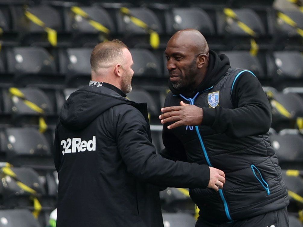 Soccer Football - Championship - Derby County v Sheffield Wednesday - Pride Park, Derby, Britain - May 8, 2021 Derby County manager Wayne Rooney and Sheffield Wednesday manager Darren Moore after the match Action Images via Reuters/Molly Darlington EDITORIAL USE ONLY. No use with unauthorized audio, video, data, fixture lists, club/league logos or 'live' services. Online in-match use limited to 75 images, no video emulation. No use in betting, games or single club /league/player publications.  P