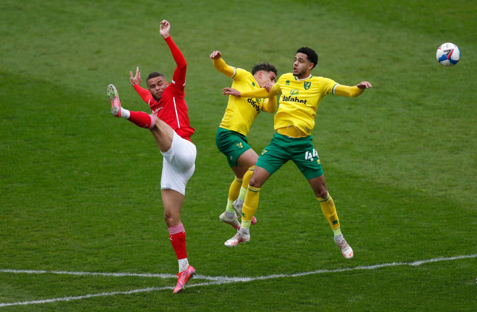 Soccer Football - Championship - Barnsley v Norwich City - Oakwell, Barnsley, Britain - May 8, 2021 Norwich City's Andrew Omobamidele in action with Barnsley's Carlton Morris Action Images via Reuters/Lee Smith EDITORIAL USE ONLY. No use with unauthorized audio, video, data, fixture lists, club/league logos or 'live' services. Online in-match use limited to 75 images, no video emulation. No use in betting, games or single club /league/player publications.  Please contact your account representat
