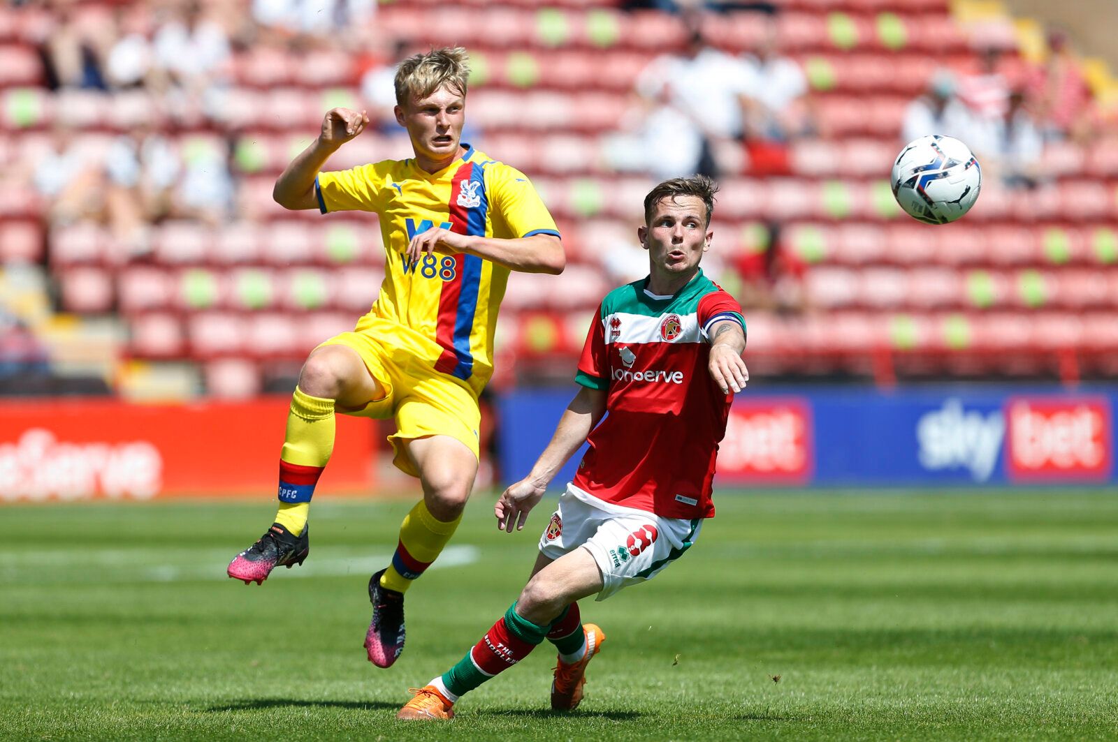 Soccer Football - Pre Season Friendly - Walsall v Crystal Palace - The Banks's Stadium, Walsall, Britain - July 17, 2021 Crystal Palace's Aidan Steele in action with Walsall's Liam Kinsella Action Images via Reuters/Craig Brough