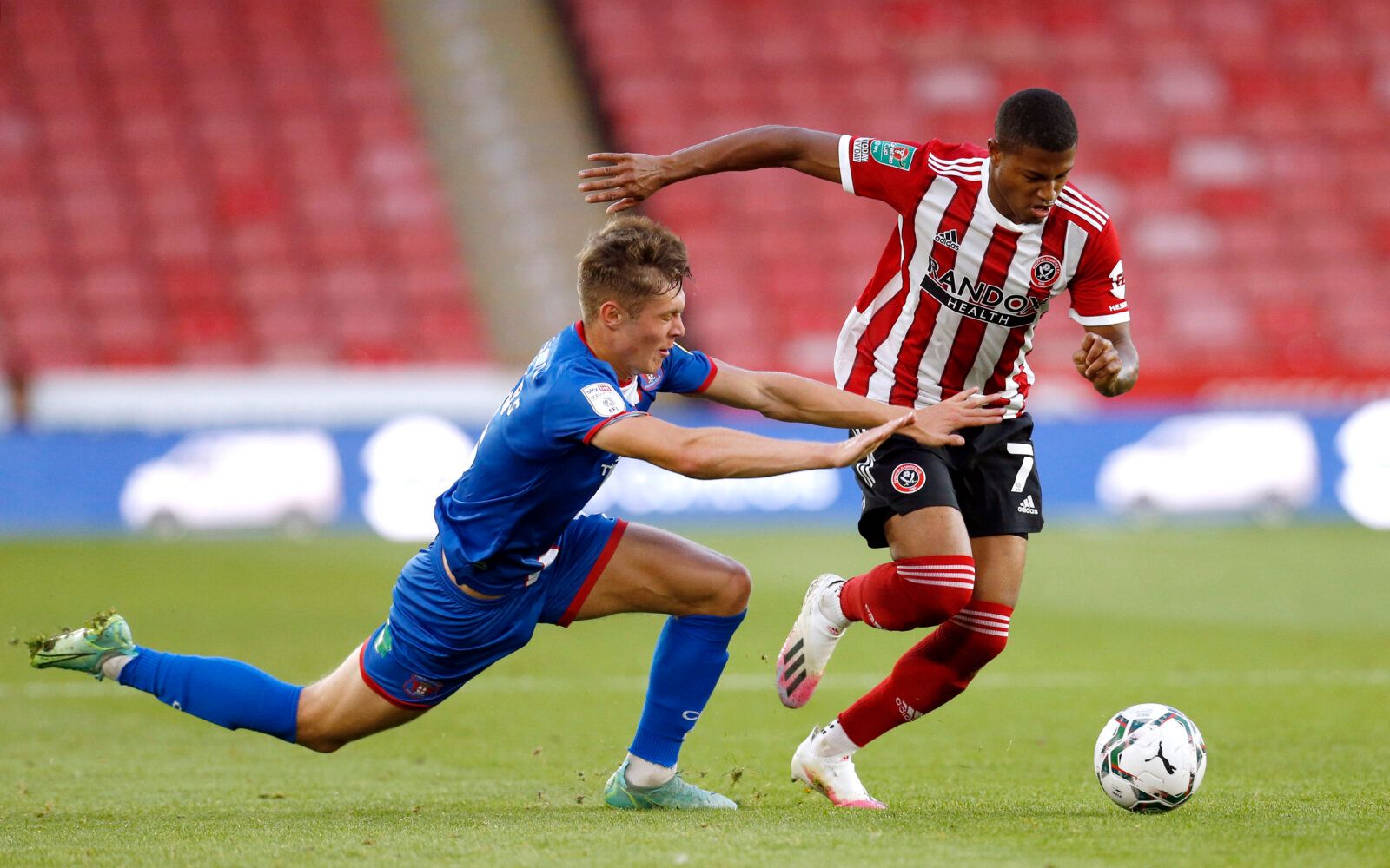 Soccer Football - Carabao Cup - First Round - Sheffield United v Carlisle United - Bramall Lane, Sheffield, Britain - August 10, 2021 Sheffield United's Rhian Brewster and Carlisle United's Taylor Charters in action Action Images/Ed Sykes EDITORIAL USE ONLY. No use with unauthorized audio, video, data, fixture lists, club/league logos or 'live' services. Online in-match use limited to 75 images, no video emulation. No use in betting, games or single club /league/player publications.  Please cont