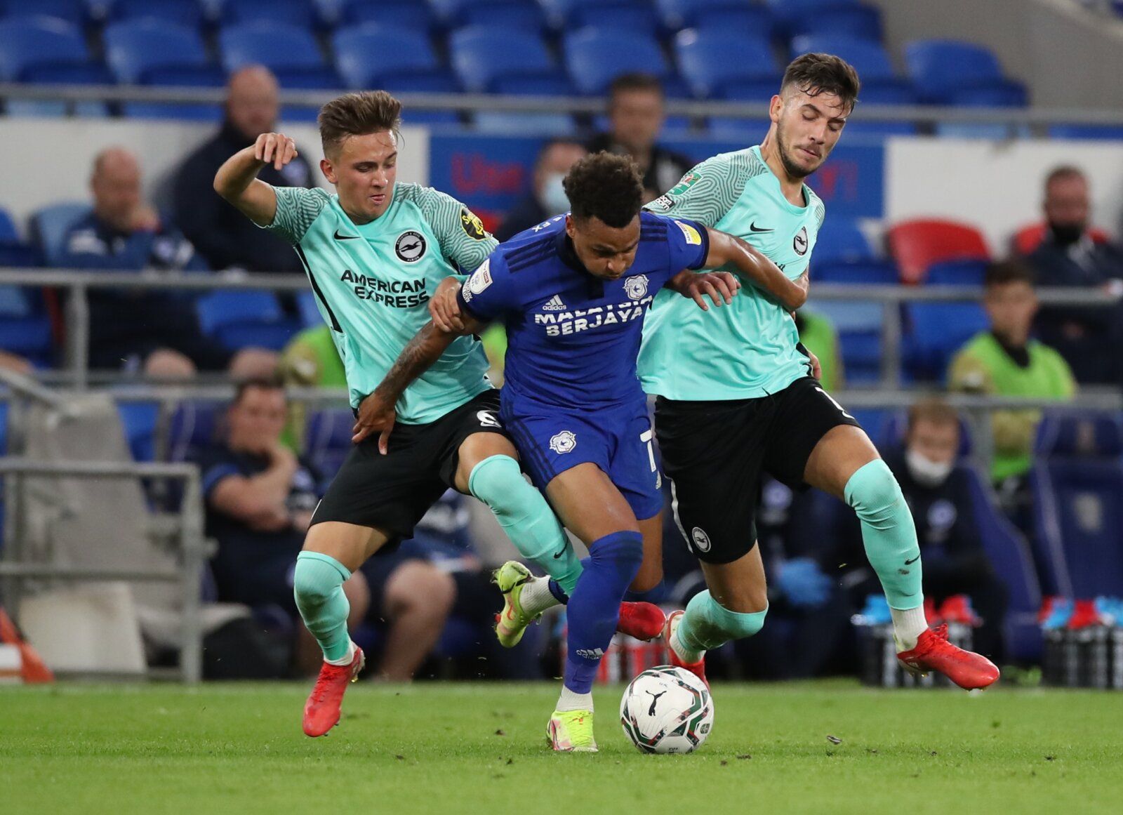 Soccer - England - Carabao Cup Second Round - Cardiff City v Brighton &amp; Hove Albion - Cardiff City Stadium, Cardiff, Britain - August 24, 2021 Cardiff City's Josh Murphy in action with Brighton &amp; Hove Albion's Michal Karbownik and Jakub Moder Action Images via Reuters/Peter Cziborra