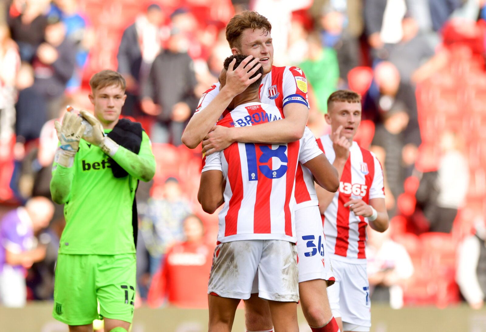 Soccer Football - Championship - Stoke City v Huddersfield Town - bet365 Stadium, Stoke-on-Trent, Britain - September 11, 2021 Stoke City's Jacob Brown celebrates with Harry Souttar after the match  Action Images/Paul Burrows  EDITORIAL USE ONLY. No use with unauthorized audio, video, data, fixture lists, club/league logos or 