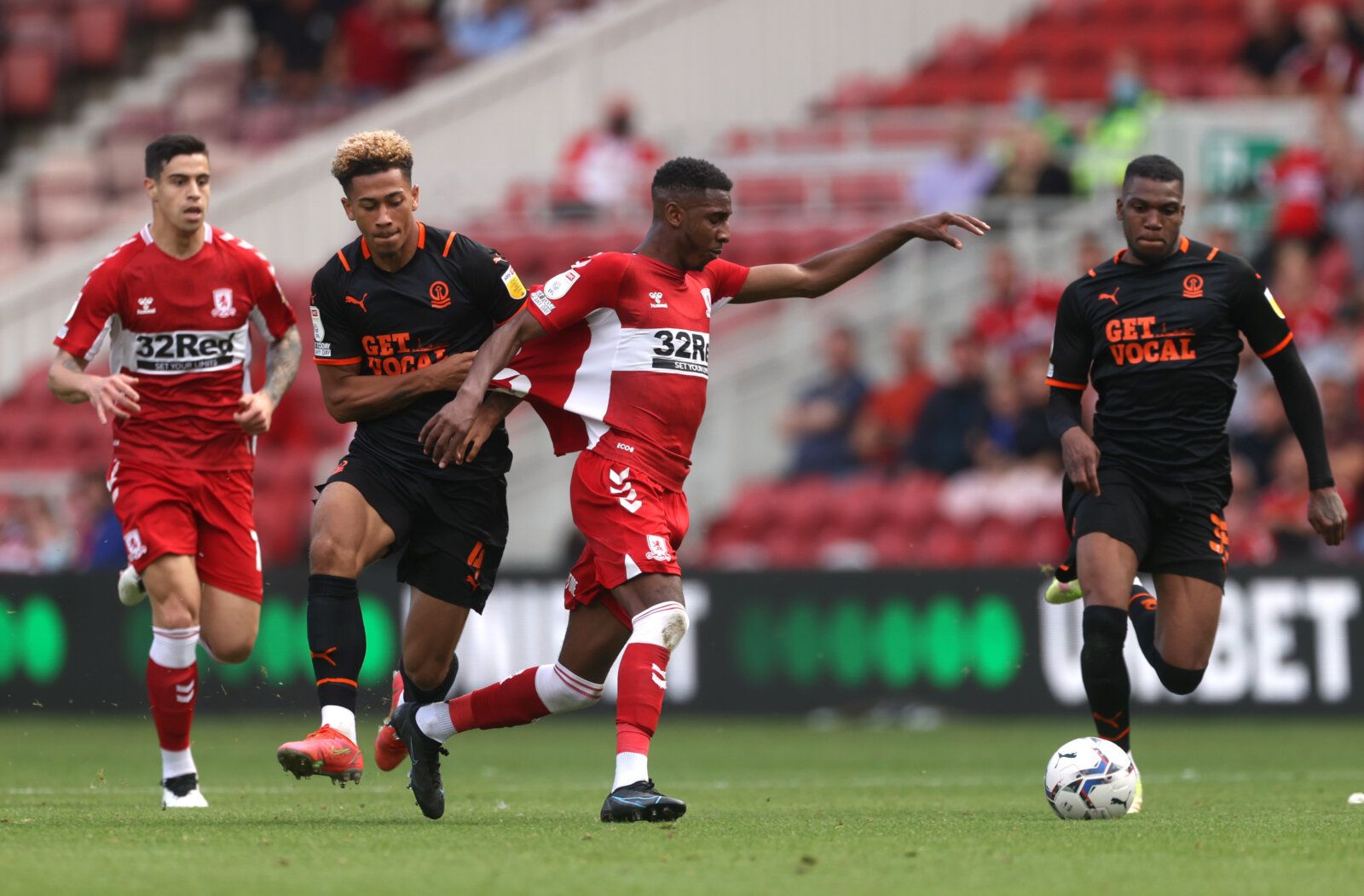 Soccer Football - Championship - Middlesbrough v Blackpool - Riverside Stadium, Middlesbrough, Britain - September 18, 2021 Middlesbrough's Isaiah Jones in action with Blackpool's Jordan Lawrence-Gabriel Action Images/Lee Smith EDITORIAL USE ONLY. No use with unauthorized audio, video, data, fixture lists, club/league logos or 'live' services. Online in-match use limited to 75 images, no video emulation. No use in betting, games or single club /league/player publications.  Please contact your ac