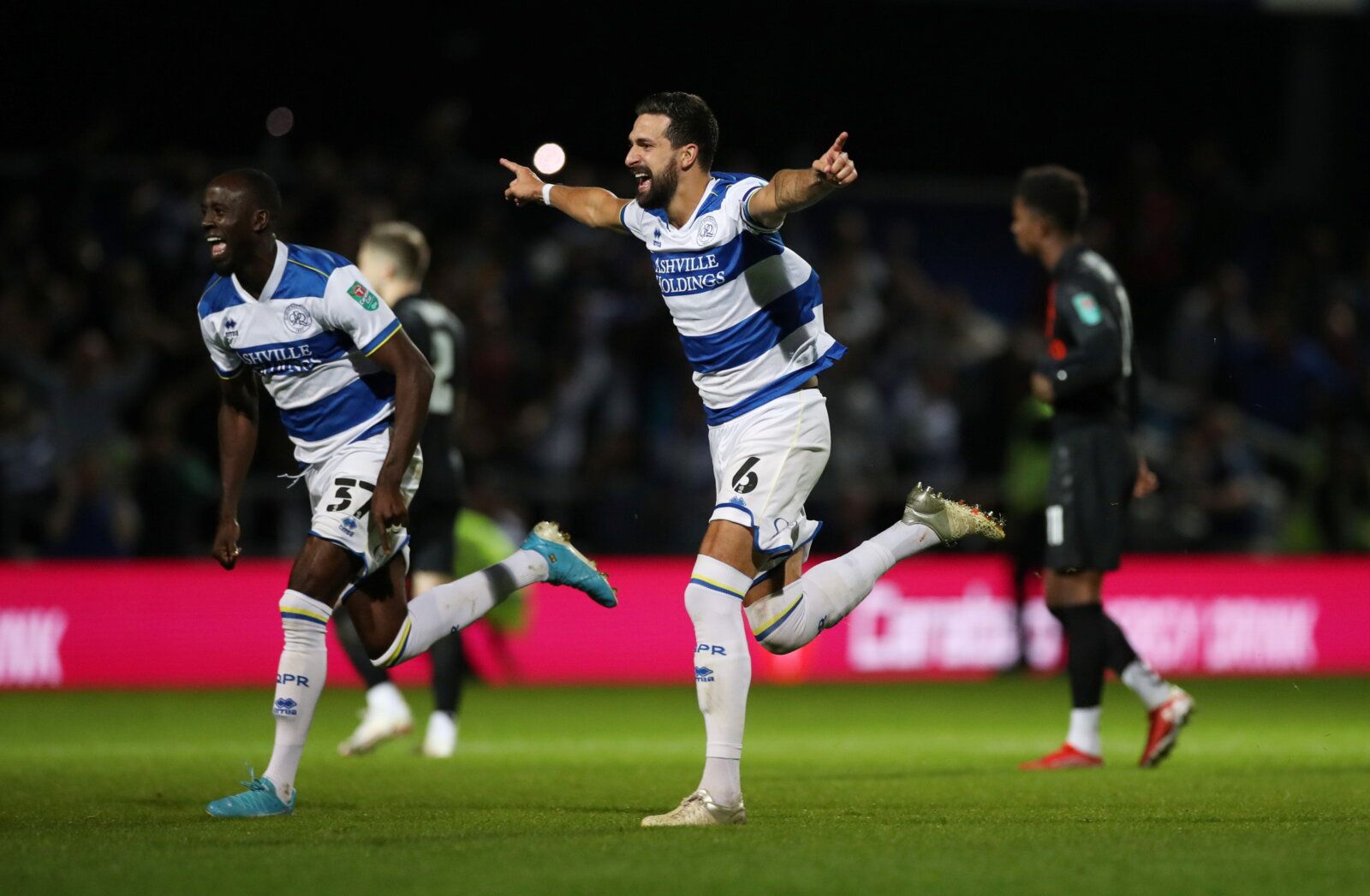 Soccer Football - Carabao Cup - Third Round - Queens Park Rangers v Everton - Loftus Road, London, Britain - September 21, 2021   Queens Park Rangers' Yoann Barbet and Albert Adomah celebrate after winning the penalty shoot-out  Action Images via Reuters/Peter Cziborra   EDITORIAL USE ONLY. No use with unauthorized audio, video, data, fixture lists, club/league logos or 'live' services. Online in-match use limited to 75 images, no video emulation. No use in betting, games or single club /league/