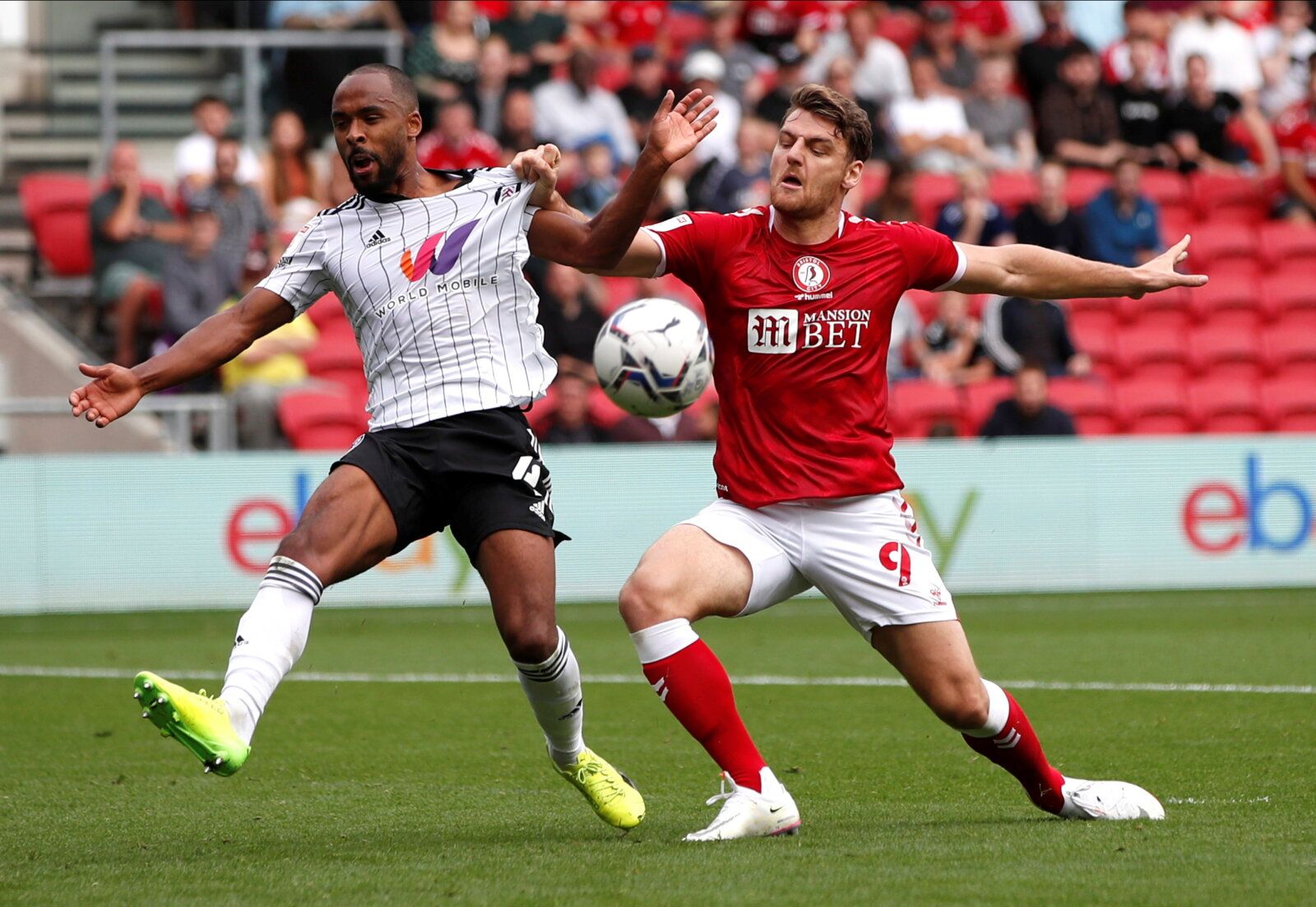 Soccer Football - Championship - Bristol City v Fulham - Ashton Gate Stadium, Bristol, Britain - September 25, 2021  Fulham's Denis Odoi in action with Bristol City's Chris Martin  Action Images/Paul Childs  EDITORIAL USE ONLY. No use with unauthorized audio, video, data, fixture lists, club/league logos or 