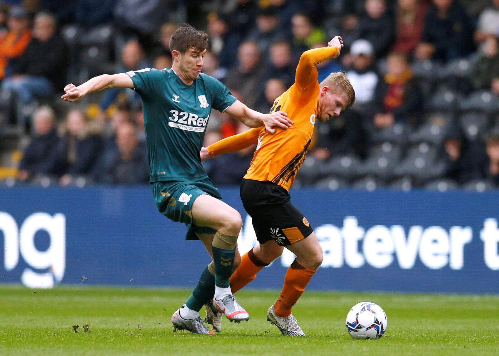 Soccer Football - Championship - Hull City v Middlesbrough - KCOM Stadium, Hull, Britain - October 2, 2021  Hull City's Andy Cannon in action with Middlesbrough's Paddy McNair  Action Images/Ed Sykes  EDITORIAL USE ONLY. No use with unauthorized audio, video, data, fixture lists, club/league logos or 