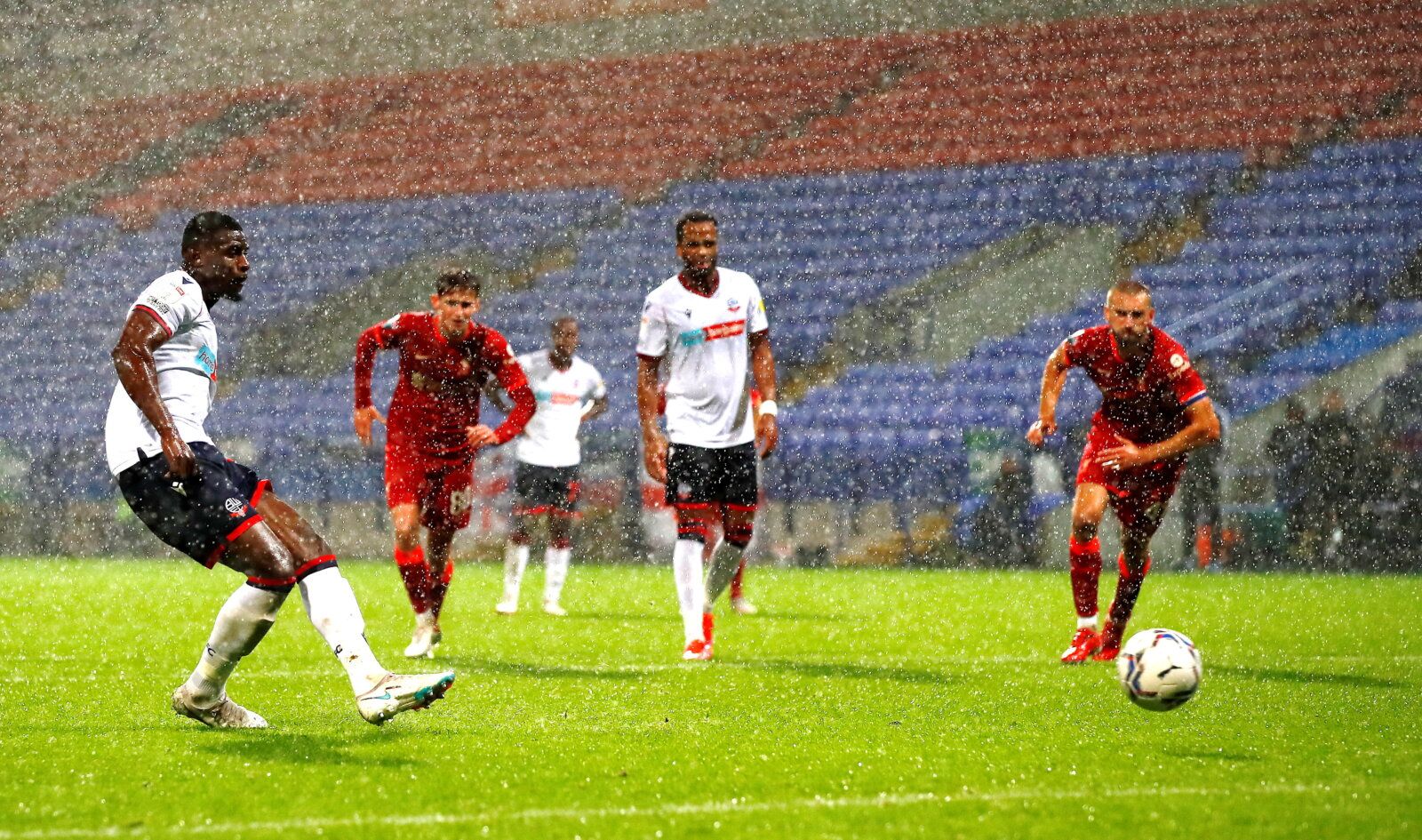 Soccer Football - EFL Trophy - Group Stage - Bolton Wanderers v Liverpool U21 - University of Bolton Stadium, Bolton, Britain - October 5, 2021  Bolton Wanderers' Amadou Bakayoko scores their fourth goal from the penalty spot  Action Images/Jason Cairnduff  EDITORIAL USE ONLY. No use with unauthorized audio, video, data, fixture lists, club/league logos or 