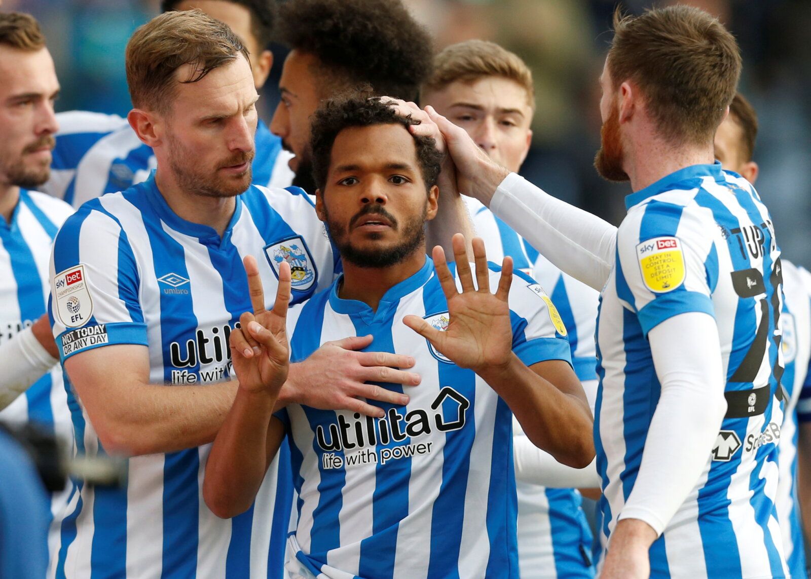 Soccer Football - Championship - Huddersfield Town v Hull City - John Smith's Stadium, Huddersfield, Britain - October 16, 2021 Huddersfield Town's Duane Holmes celebrates scoring their second goal with teammates   Action Images/Ed Sykes  EDITORIAL USE ONLY. No use with unauthorized audio, video, data, fixture lists, club/league logos or 