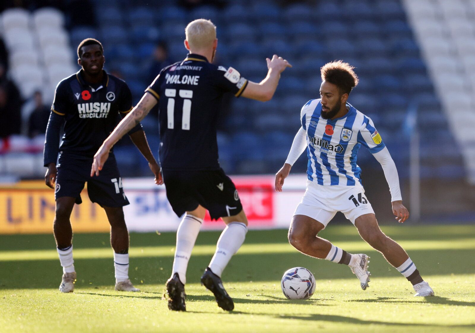 Soccer Football - Championship - Huddersfield Town v Millwall - John Smith's Stadium, Huddersfield, Britain - October 30, 2021 Huddersfield Town's Sorba Thomas in action with Millwall's Scott Malone  Action Images/John Clifton  EDITORIAL USE ONLY. No use with unauthorized audio, video, data, fixture lists, club/league logos or 