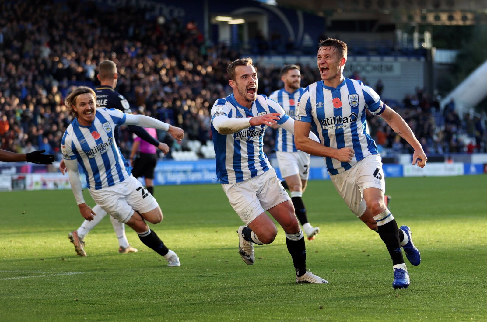Soccer Football - Championship - Huddersfield Town v Millwall - John Smith's Stadium, Huddersfield, Britain - October 30, 2021 Huddersfield Town's Jonathan Hogg celebrates scoring their first goal with teammates  Action Images/John Clifton  EDITORIAL USE ONLY. No use with unauthorized audio, video, data, fixture lists, club/league logos or 