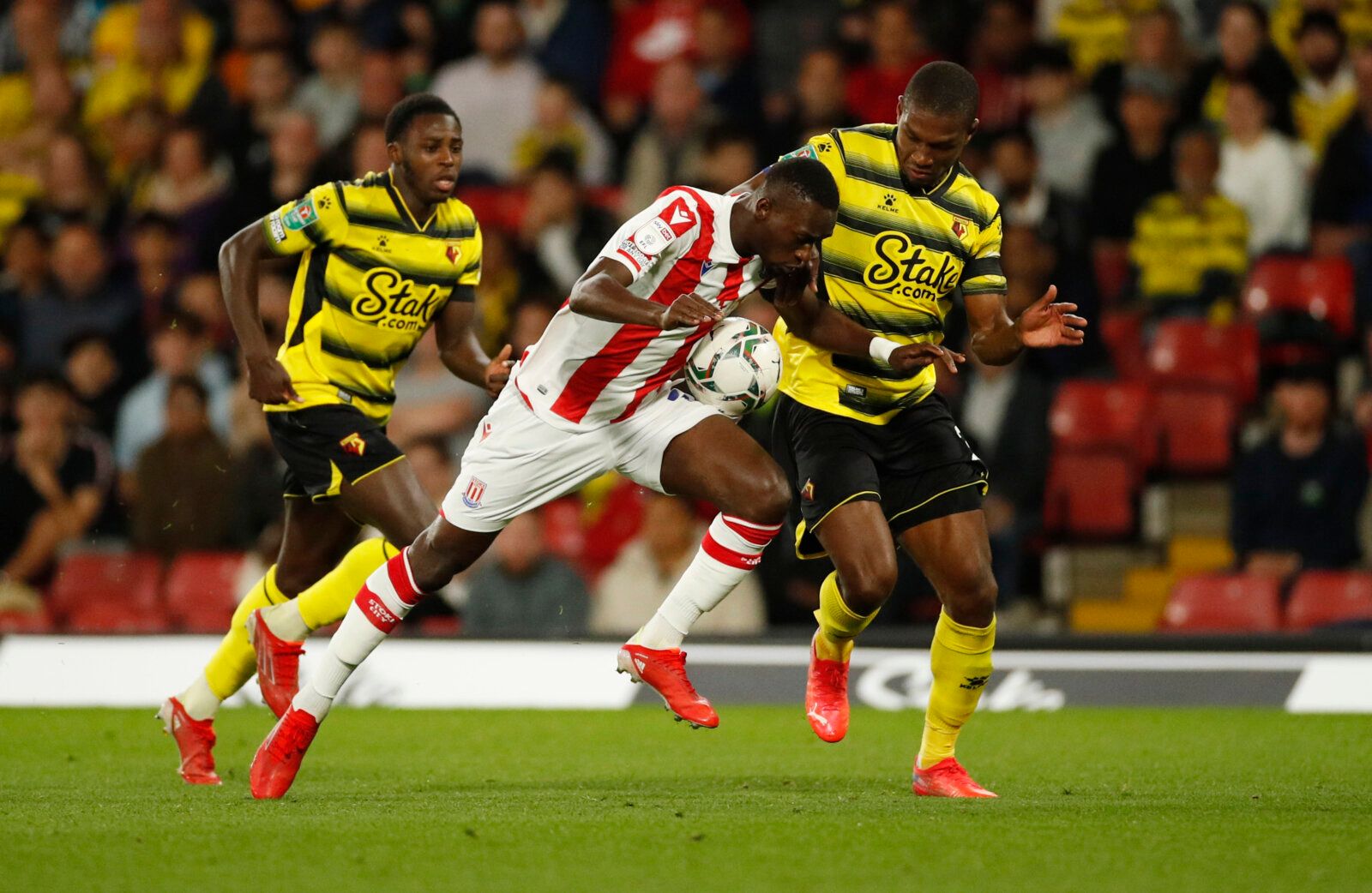 Soccer Football - Carabao Cup - Third Round - Watford v Stoke City - Vicarage Road, Watford, Britain - September 21, 2021 Watford's Christian Kabasele in action with Stoke's Abdallah Sima Action Images via Reuters/Andrew Boyers EDITORIAL USE ONLY. No use with unauthorized audio, video, data, fixture lists, club/league logos or 'live' services. Online in-match use limited to 75 images, no video emulation. No use in betting, games or single club /league/player publications.  Please contact your ac