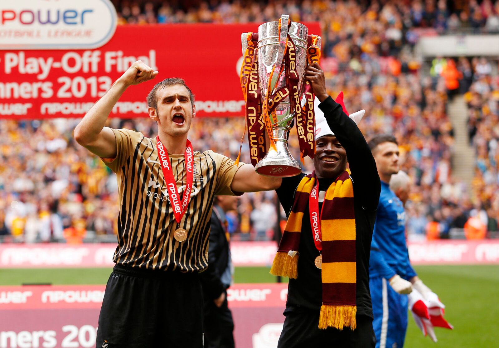 Football - Bradford City v Northampton Town - npower Football League Two Play-Off Final - Wembley Stadium - 18/5/13 
Bradford City's Kyel Reid and James Hanson celebrate promotion to League one with the trophy 
Mandatory Credit: Action Images / John Sibley 
Livepic 
EDITORIAL USE ONLY. No use with unauthorized audio, video, data, fixture lists, club/league logos or live services. Online in-match use limited to 45 images, no video emulation. No use in betting, games or single club/league/player p