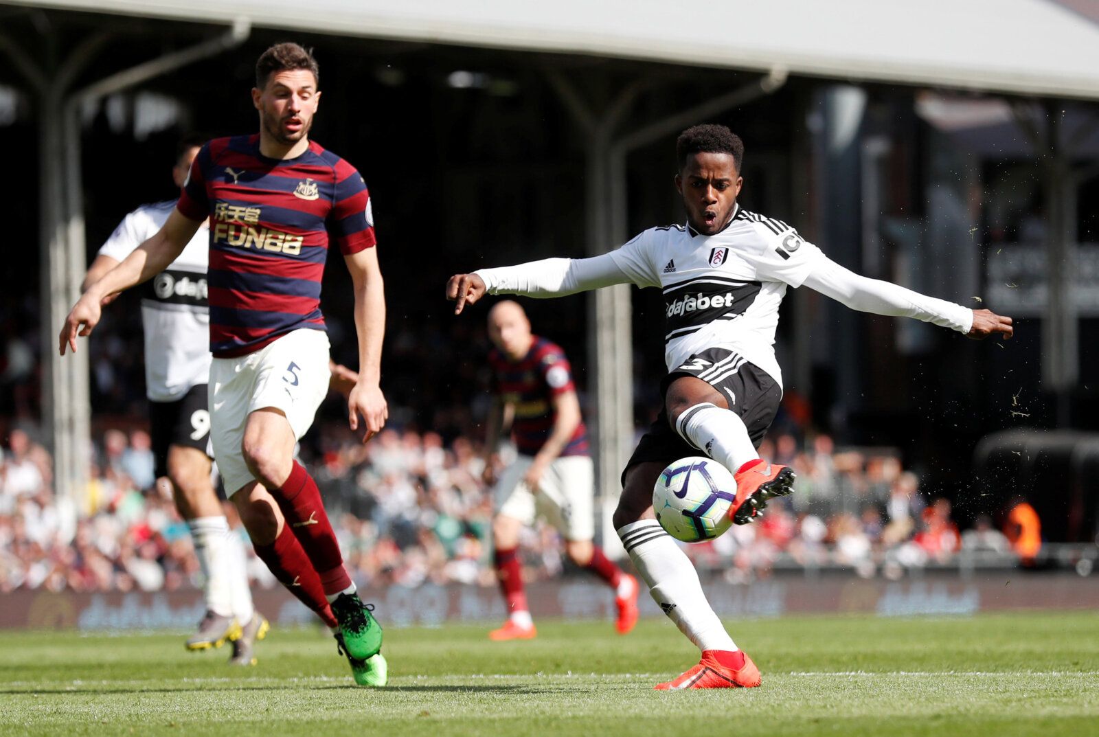 Soccer Football - Premier League - Fulham v Newcastle United - Craven Cottage, London, Britain - May 12, 2019  Fulham's Ryan Sessegnon shoots at goal as Newcastle United's Fabian Schar looks on  Action Images via Reuters/Peter Cziborra  EDITORIAL USE ONLY. No use with unauthorized audio, video, data, fixture lists, club/league logos or 