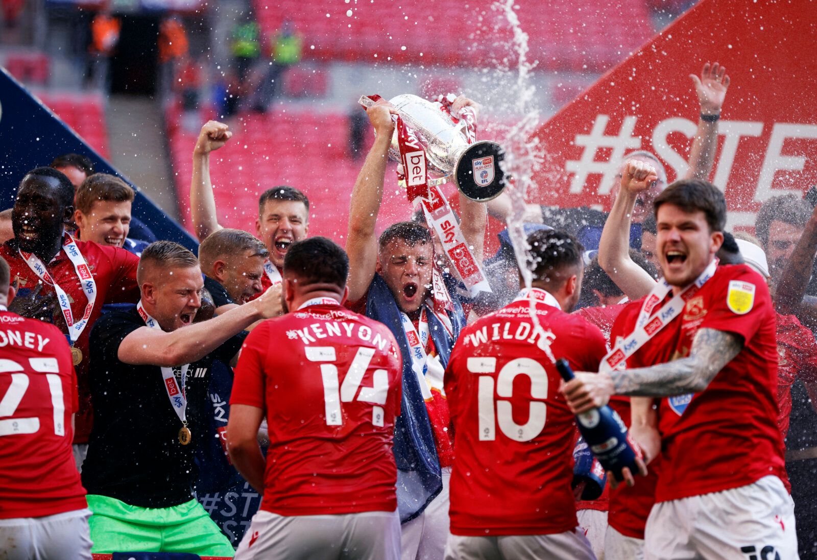 Soccer Football - League Two Play-Off Final - Morecambe v Newport County - Wembley Stadium, London, Britain - May 31, 2021 Morecambe celebrates with the trophy after winning the League Two Play-Off Final Action Images/John Sibley EDITORIAL USE ONLY. No use with unauthorized audio, video, data, fixture lists, club/league logos or 'live' services. Online in-match use limited to 75 images, no video emulation. No use in betting, games or single club /league/player publications.  Please contact your 
