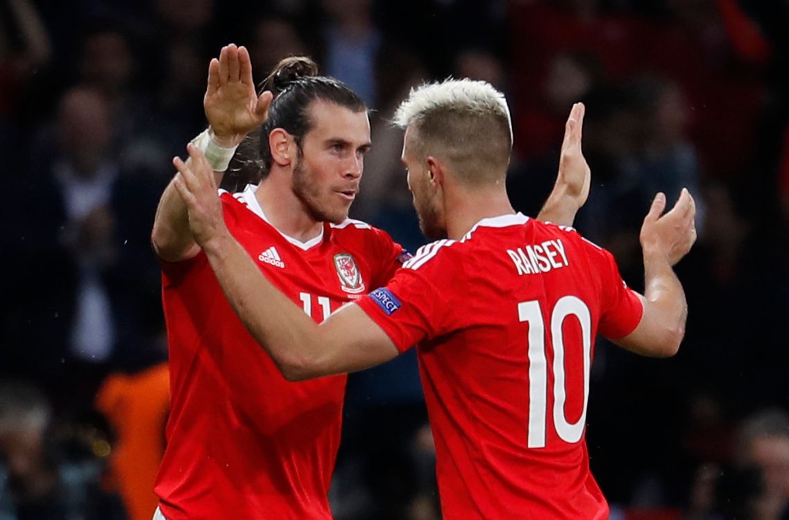 Football Soccer - Wales v Belgium - EURO 2016 - Quarter Final - Stade Pierre-Mauroy, Lille, France - 1/7/16 
Wales' Aaron Ramsey and Gareth Bale celebrate their second goal 
REUTERS/Pascal Rossignol 
Livepic