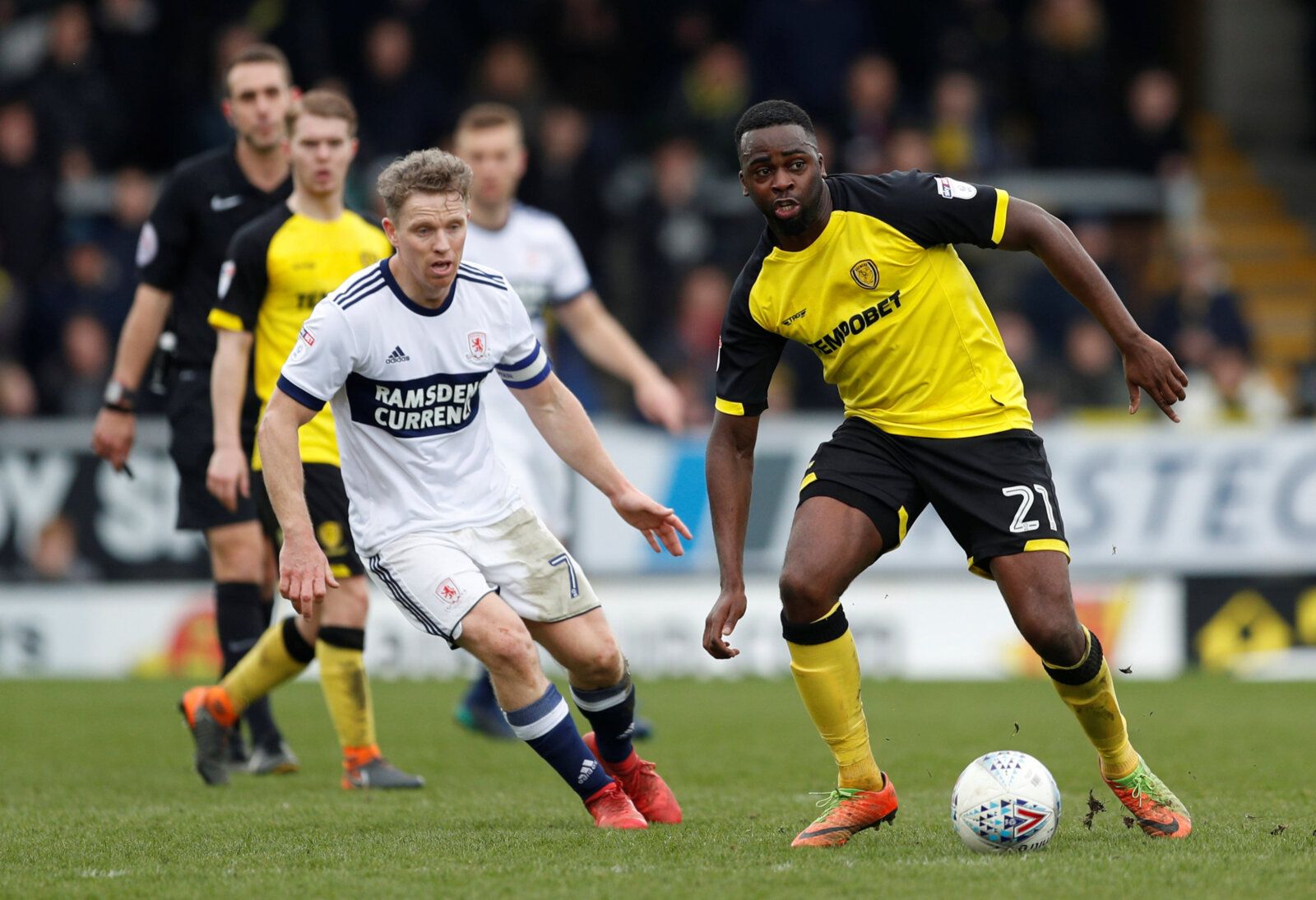 Soccer Football - Championship - Burton Albion vs Middlesbrough - Pirelli Stadium, Burton-on-Trent, Britain - April 2, 2018   Burton Albion's Hope Akpan in action with Middlesbrough's Grant Leadbitter         Action Images/Andrew Boyers    EDITORIAL USE ONLY. No use with unauthorized audio, video, data, fixture lists, club/league logos or 