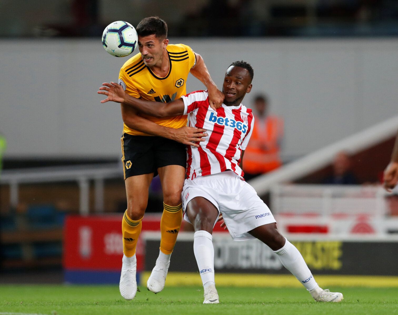 Soccer Football - Pre Season Friendly - Stoke City v Wolverhampton Wanderers - bet365 Stadium, Stoke-on-Trent, Britain - July 25, 2018   Wolverhampton Wanderers’ Danny Batth in action with Stoke City's Saido Berahino     Action Images via Reuters/Matthew Childs