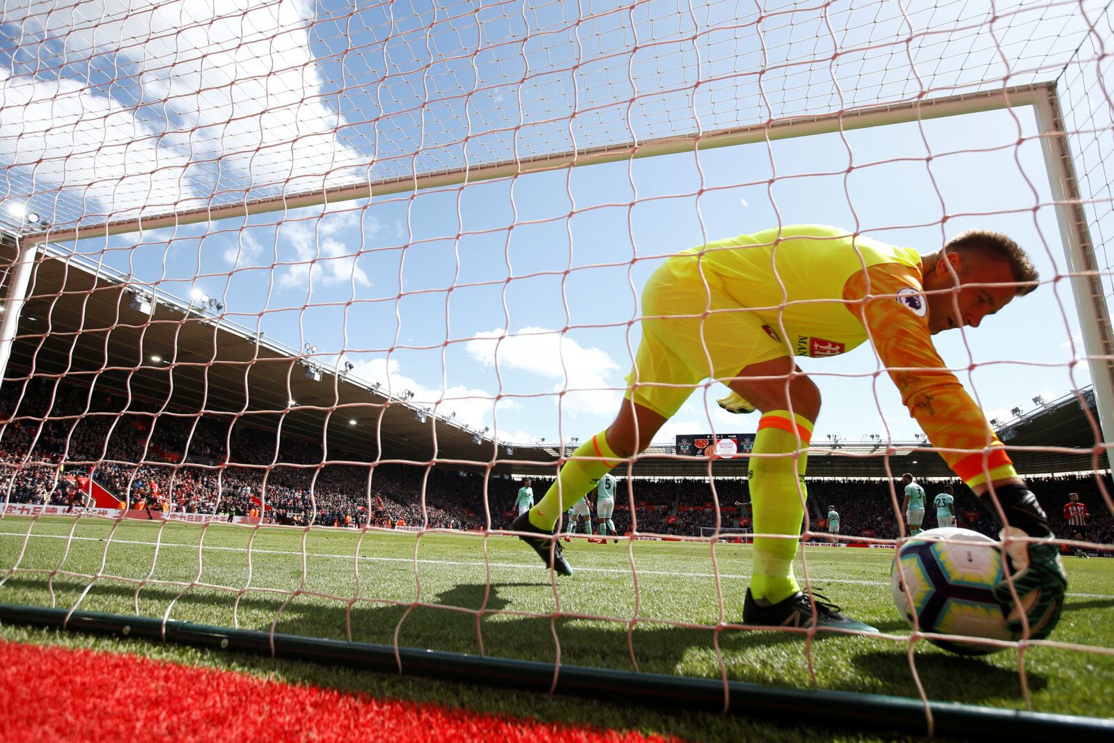 Soccer Football - Premier League - Southampton v AFC Bournemouth - St Mary's Stadium,  Southampton, Britain - April 27, 2019  Bournemouth's Artur Boruc collects the ball after Southampton's Shane Long scores their first goal    REUTERS/Peter Nicholls  EDITORIAL USE ONLY. No use with unauthorized audio, video, data, fixture lists, club/league logos or 