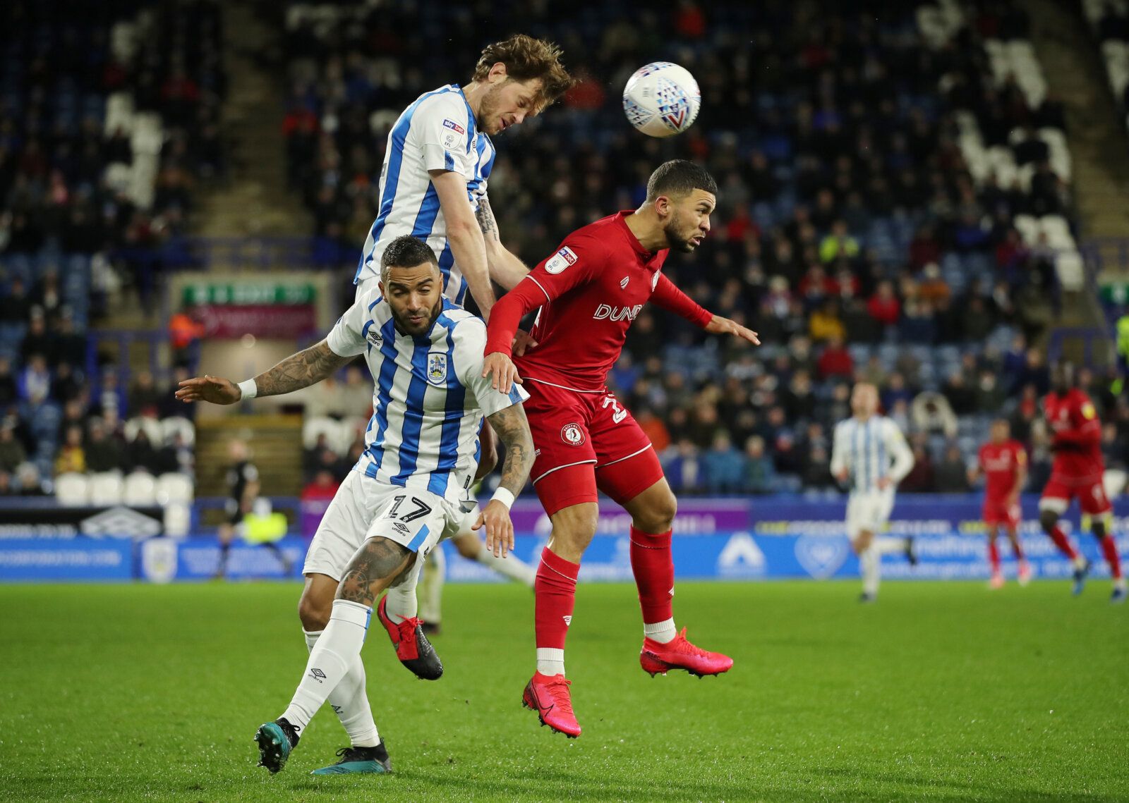 Soccer Football - Championship - Huddersfield Town v Bristol City - John Smith's Stadium, Huddersfield, Britain - February 25, 2020   Bristol City's Nahki Wells in action with Huddersfield Town's Danny Simpson and Richard Stearman   Action Images/Molly Darlington    EDITORIAL USE ONLY. No use with unauthorized audio, video, data, fixture lists, club/league logos or 