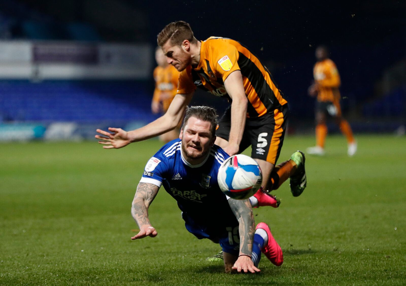 Soccer Football - League One - Ipswich Town v Hull City - Portman Road, Ipswich, Britain - November 24, 2020 Ipswich's James Norwood in action with Hull's Reece Burke Action Images/Paul Childs EDITORIAL USE ONLY. No use with unauthorized audio, video, data, fixture lists, club/league logos or 'live' services. Online in-match use limited to 75 images, no video emulation. No use in betting, games or single club /league/player publications.  Please contact your account representative for further de