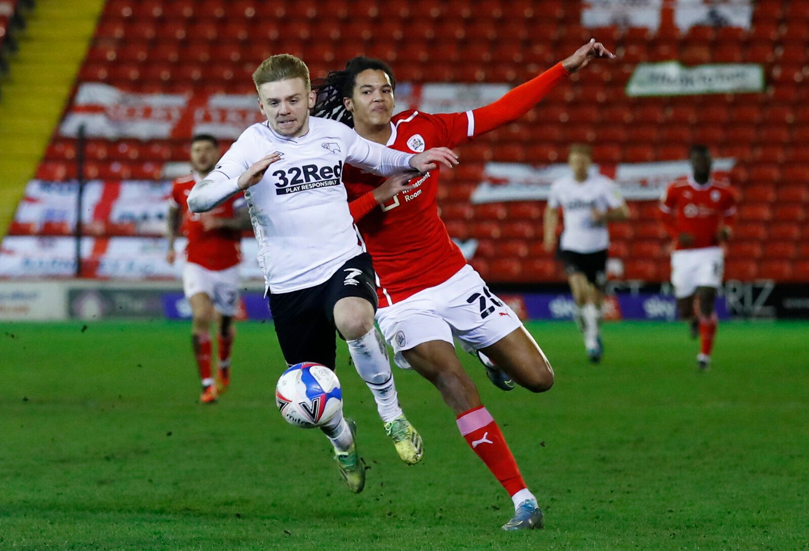 Soccer Football - Championship - Barnsley v Derby County - Oakwell, Barnsley, Britain - March 10, 2021 Barnsley's Toby Sibbick in action with Derby County's Kamil Jozwiak Action Images/Jason Cairnduff EDITORIAL USE ONLY. No use with unauthorized audio, video, data, fixture lists, club/league logos or 'live' services. Online in-match use limited to 75 images, no video emulation. No use in betting, games or single club /league/player publications.  Please contact your account representative for fu