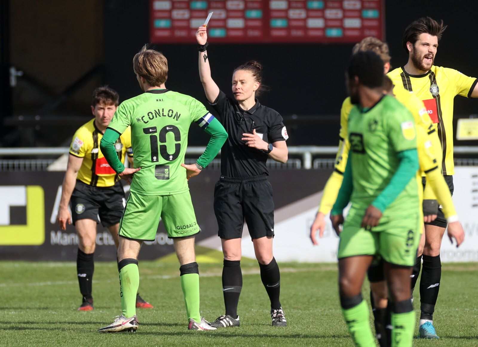 Soccer Football - League Two - Harrogate Town v Port Vale - Wetherby Road, Harrogate, Britain - April 5, 2021 Port Vale's Tom Conlon is booked by referee Rebecca Welch during the match. She is the first female referee to be appointed to an English Football League match. Action Images via Reuters/Carl Recine EDITORIAL USE ONLY. No use with unauthorized audio, video, data, fixture lists, club/league logos or 'live' services. Online in-match use limited to 75 images, no video emulation. No use in b
