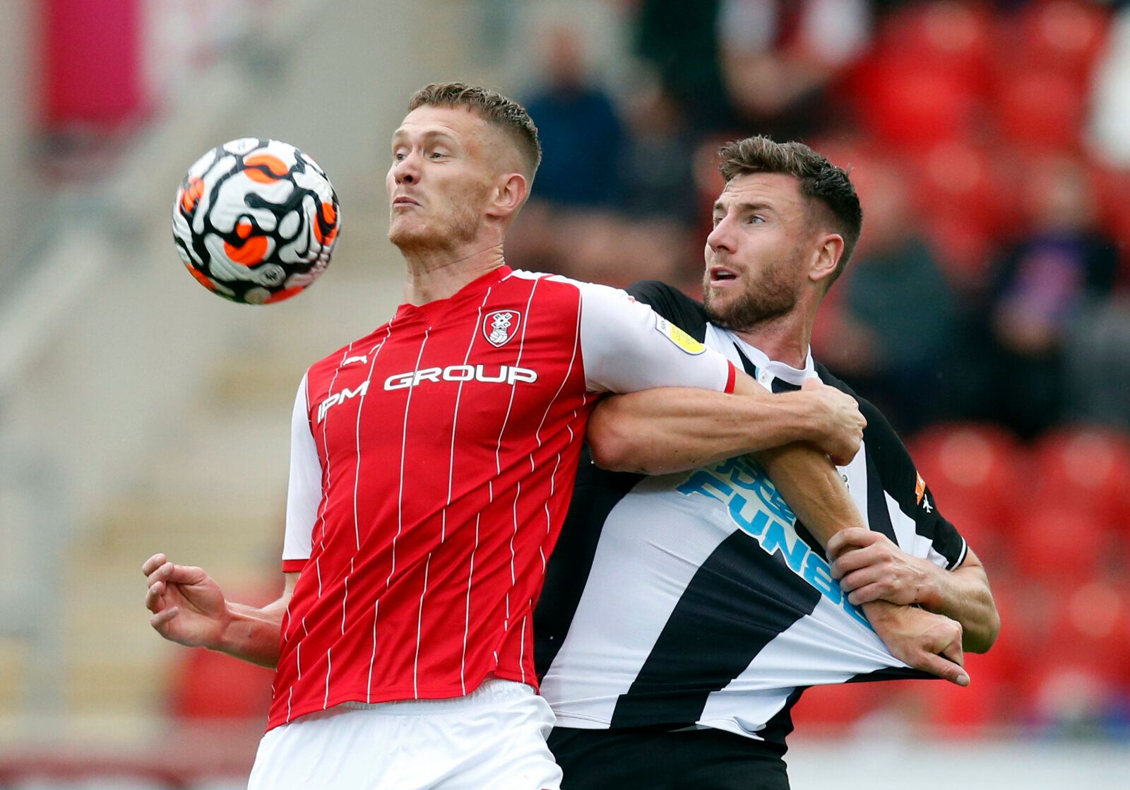 Soccer Football - Pre Season Friendly - Rotherham United v Newcastle United - AESSEAL New York Stadium, Rotherham, Britain - July 27, 2021 Rotherham United's Michael Smith in action with Newcastle United's Paul Dummett Action Images via Reuters/Ed Sykes