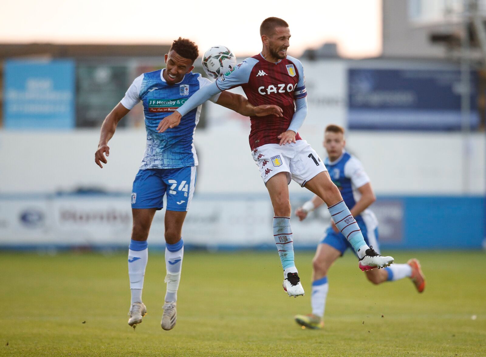 Soccer - England - Carabao Cup Second Round - Barrow v Aston Villa - Holker Street, Barrow-in-Furness, Britain - August 24, 2021 Barrow's Remeao Hutton in action with Aston Villa's Conor Hourihane Action Images via Reuters/Ed Sykes