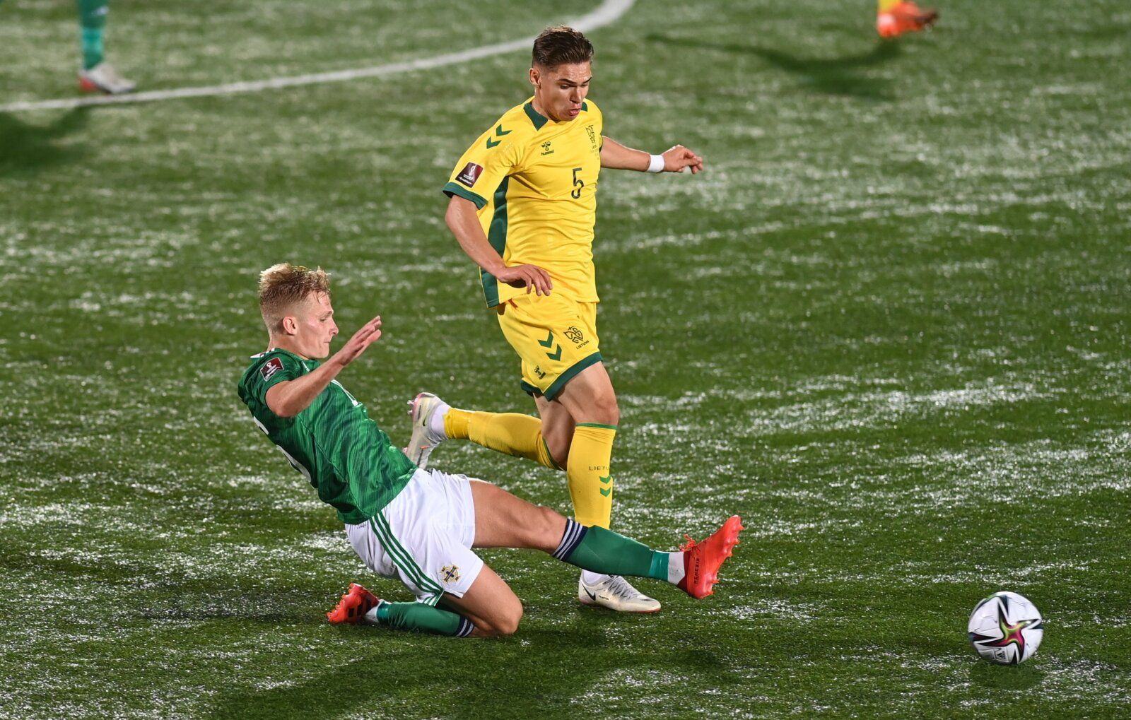 Soccer Football - World Cup - UEFA Qualifiers - Group C - Lithuania v Northern Ireland - LFF Stadium, Vilnius, Lithuania - September 2, 2021 Northern Ireland's Gavin Whyte in action with Lithuania's Karolis Uzela REUTERS/Alfredas Pliadis