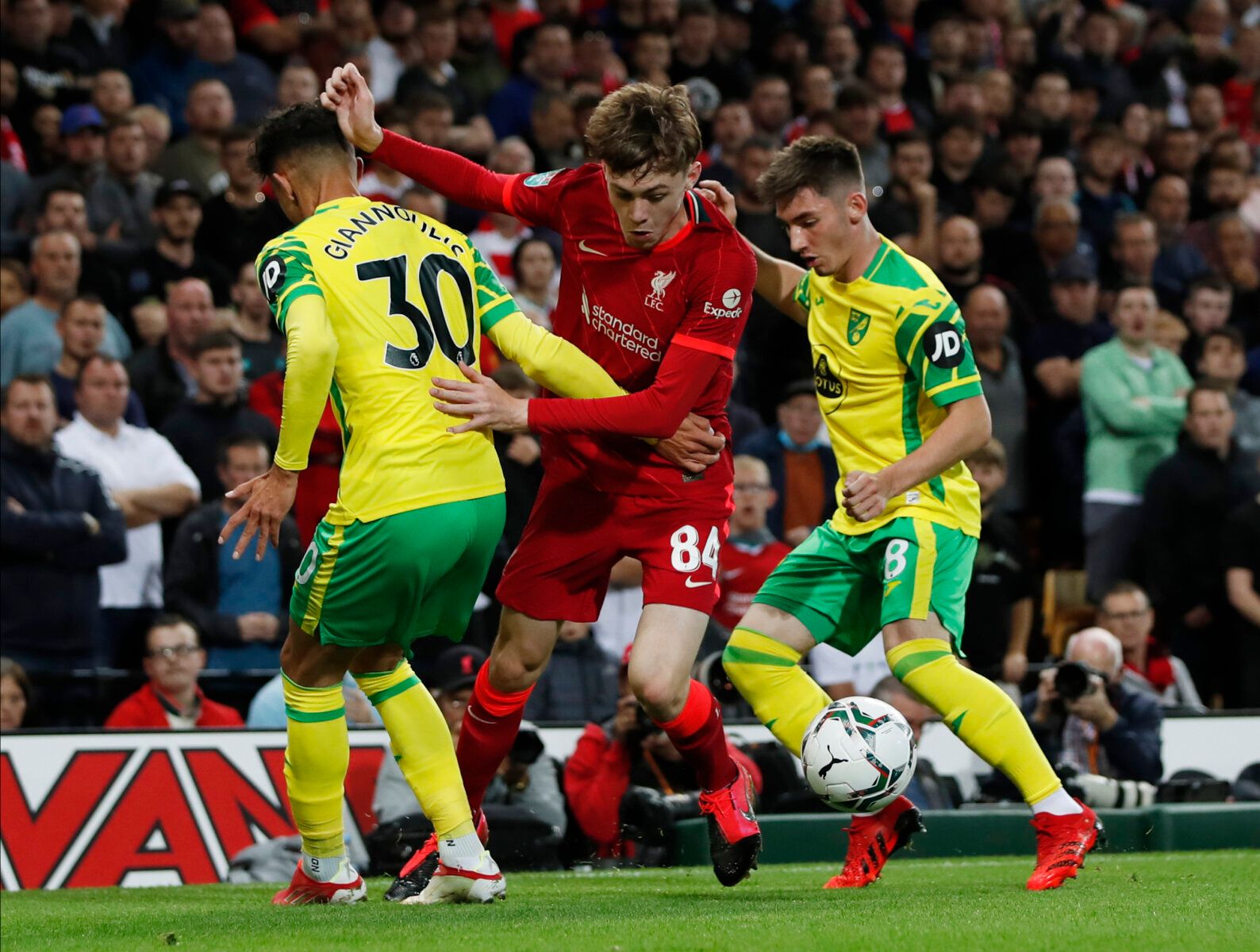 Soccer Football - Carabao Cup - Third Round - Norwich City v Liverpool - Carrow Road, Norwich, Britain - September 21, 2021 Norwich City's Dimitris Giannoulis and Billy Gilmour in action with Liverpool's Conor Bradley Action Images via Reuters/Paul Childs EDITORIAL USE ONLY. No use with unauthorized audio, video, data, fixture lists, club/league logos or 'live' services. Online in-match use limited to 75 images, no video emulation. No use in betting, games or single club /league/player publicati