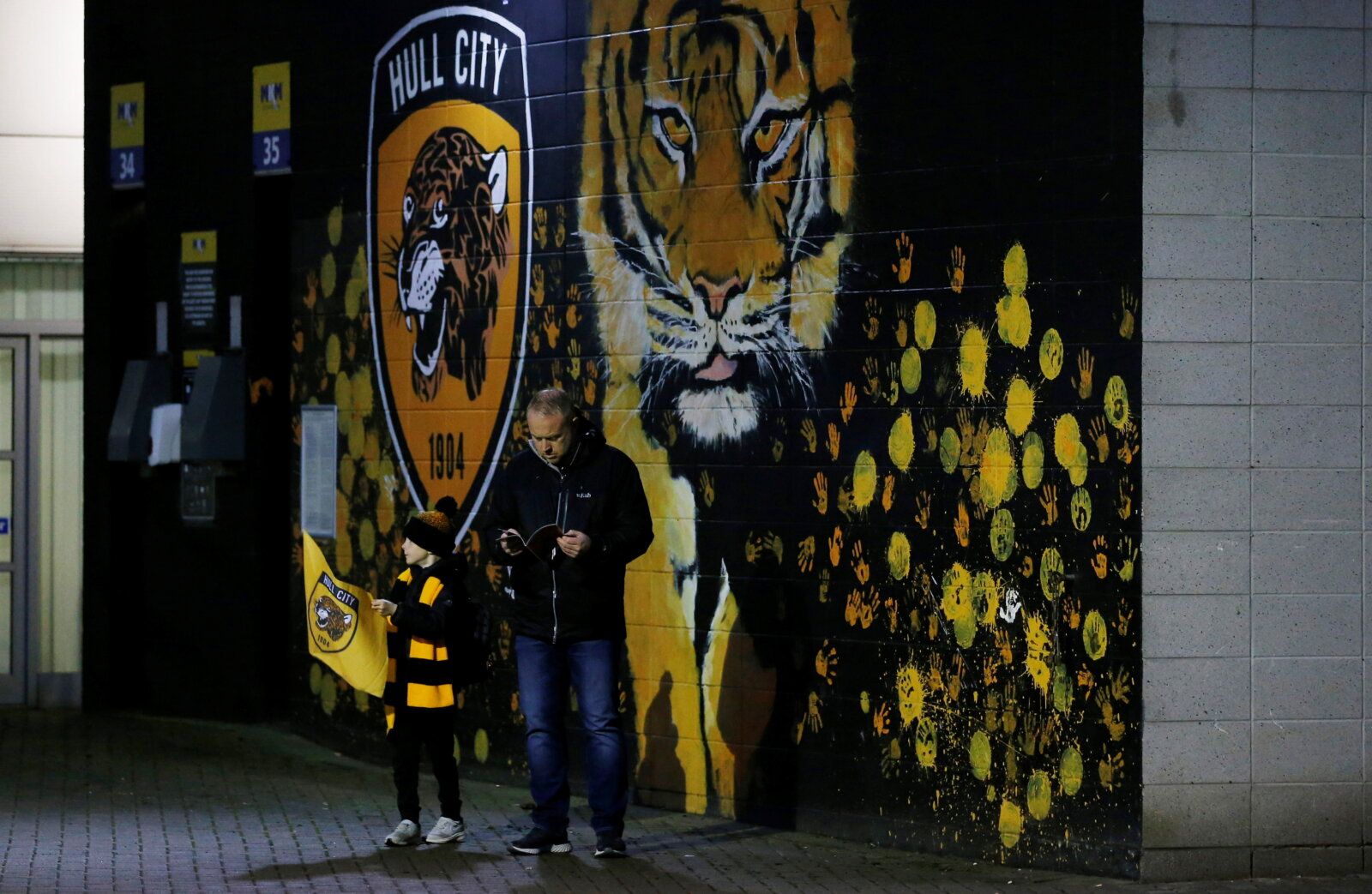Soccer Football - Championship - Hull City v Peterborough United - KCOM Stadium, Hull, Britain - October 20, 2021 Hull City fans outside the stadium before the match    Action Images/Craig Brough  EDITORIAL USE ONLY. No use with unauthorized audio, video, data, fixture lists, club/league logos or 