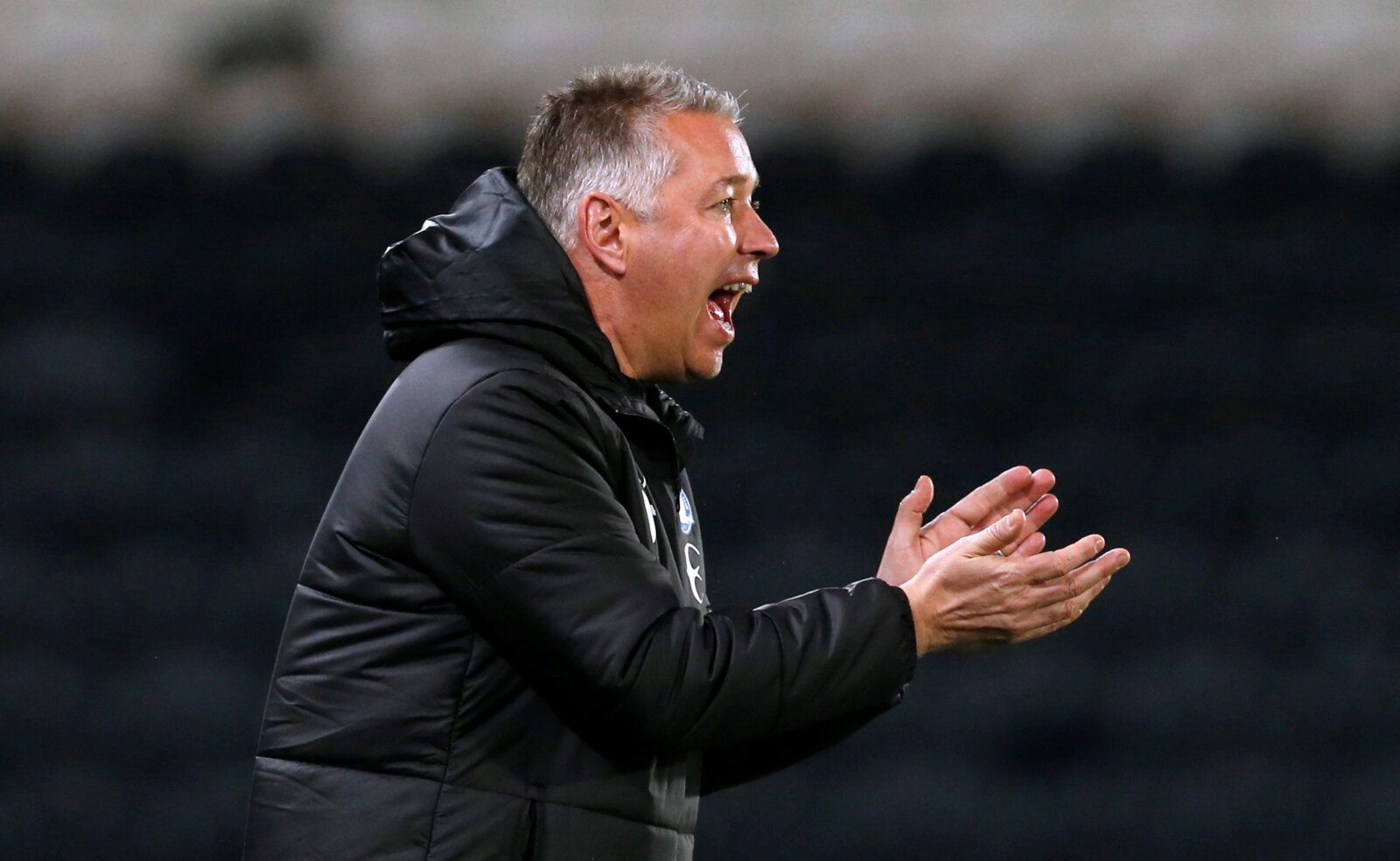 Soccer Football - Championship - Hull City v Peterborough United - KCOM Stadium, Hull, Britain - October 20, 2021  Peterborough United manager Darren Ferguson reacts  Action Images/Craig Brough  EDITORIAL USE ONLY. No use with unauthorized audio, video, data, fixture lists, club/league logos or 