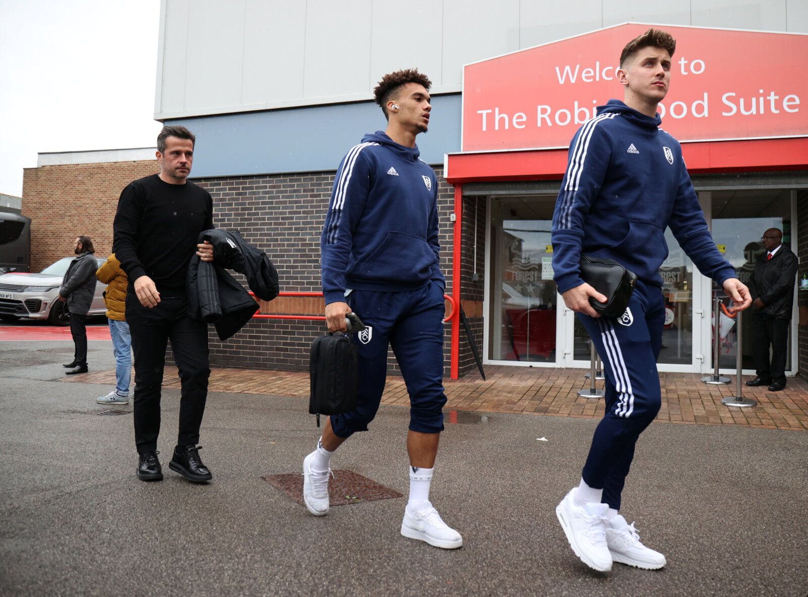 Soccer Football - Championship - Nottingham Forest v Fulham - The City Ground, Nottingham, Britain - October 24, 2021 Fulham's Tom Cairney, Antonee Robinson and manager, Marco Silva arrive at The City Ground Molly Darlington/Action Images ?EDITORIAL USE ONLY. No use with unauthorized audio, video, data, fixture lists, club/league logos or 
