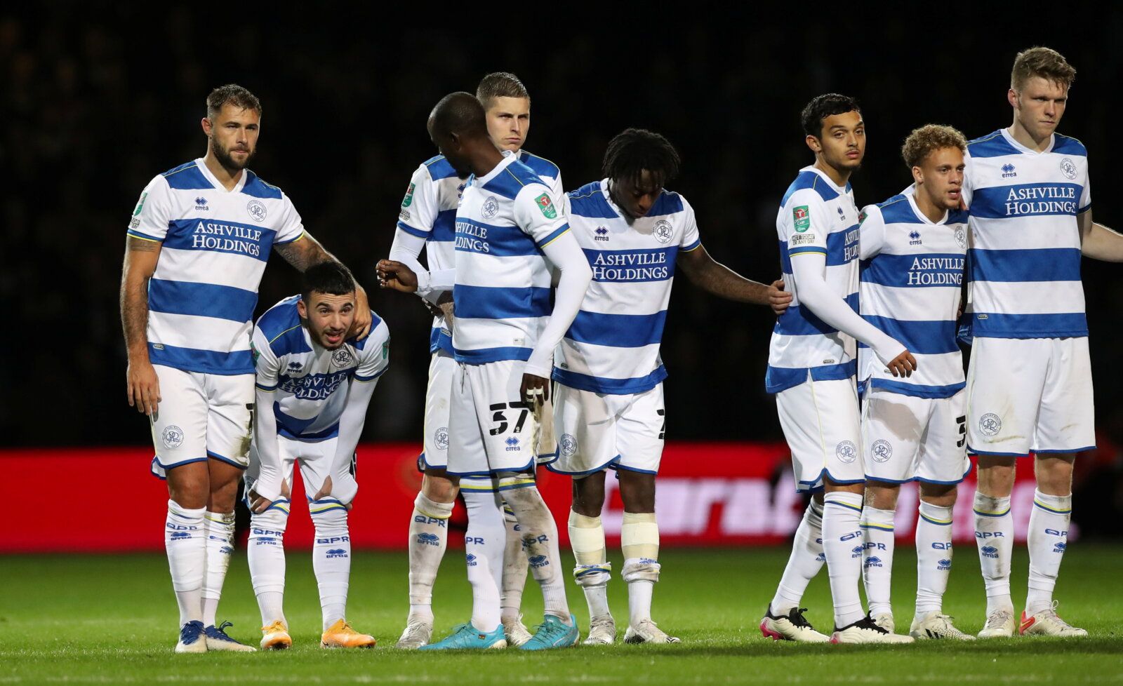 Soccer Football - Carabao Cup - Round of 16 - Queens Park Rangers v Sunderland - Loftus Road, London, Britain - October 26, 2021 Queens Park Rangers' Charlie Austin with teammates look dejected after the match  Action Images/Peter Cziborra  EDITORIAL USE ONLY. No use with unauthorized audio, video, data, fixture lists, club/league logos or 