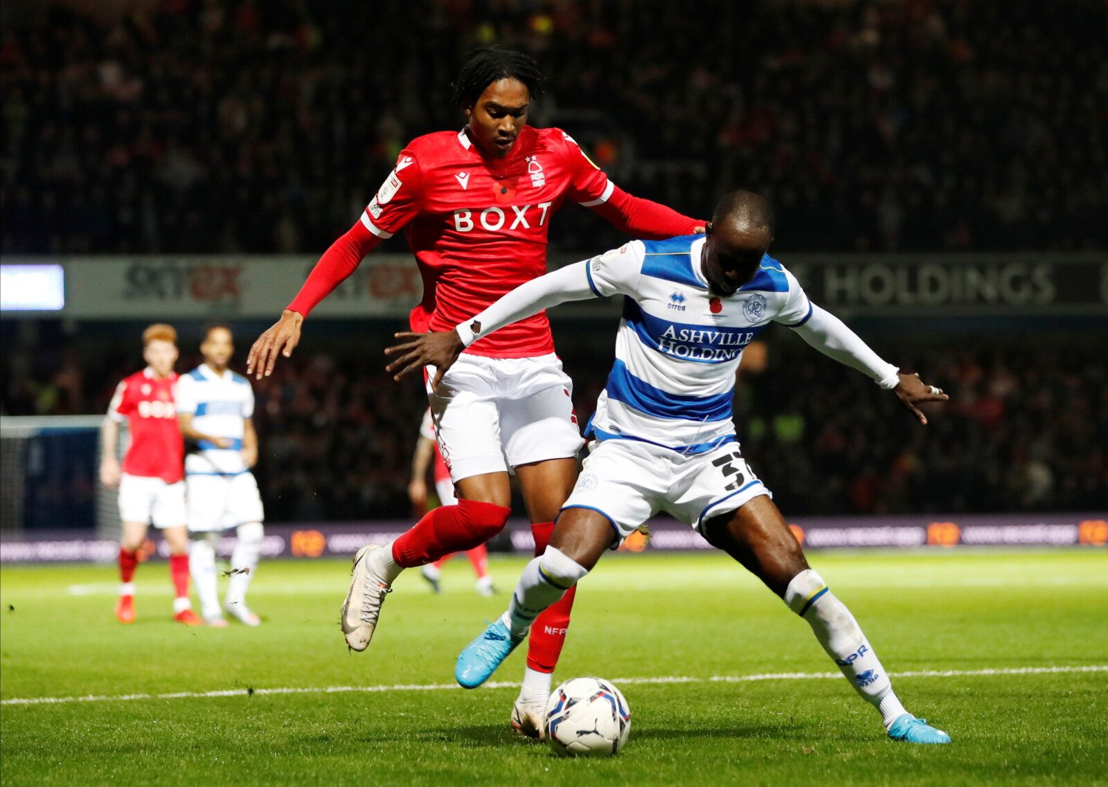 Soccer Football - Championship - Queens Park Rangers v Nottingham Forest - Loftus Road, London, Britain - October 29, 2021  Queens Park Rangers' Albert Adomah in action with Nottingham Forest's Djed Spence   Action Images/Paul Childs  EDITORIAL USE ONLY. No use with unauthorized audio, video, data, fixture lists, club/league logos or 