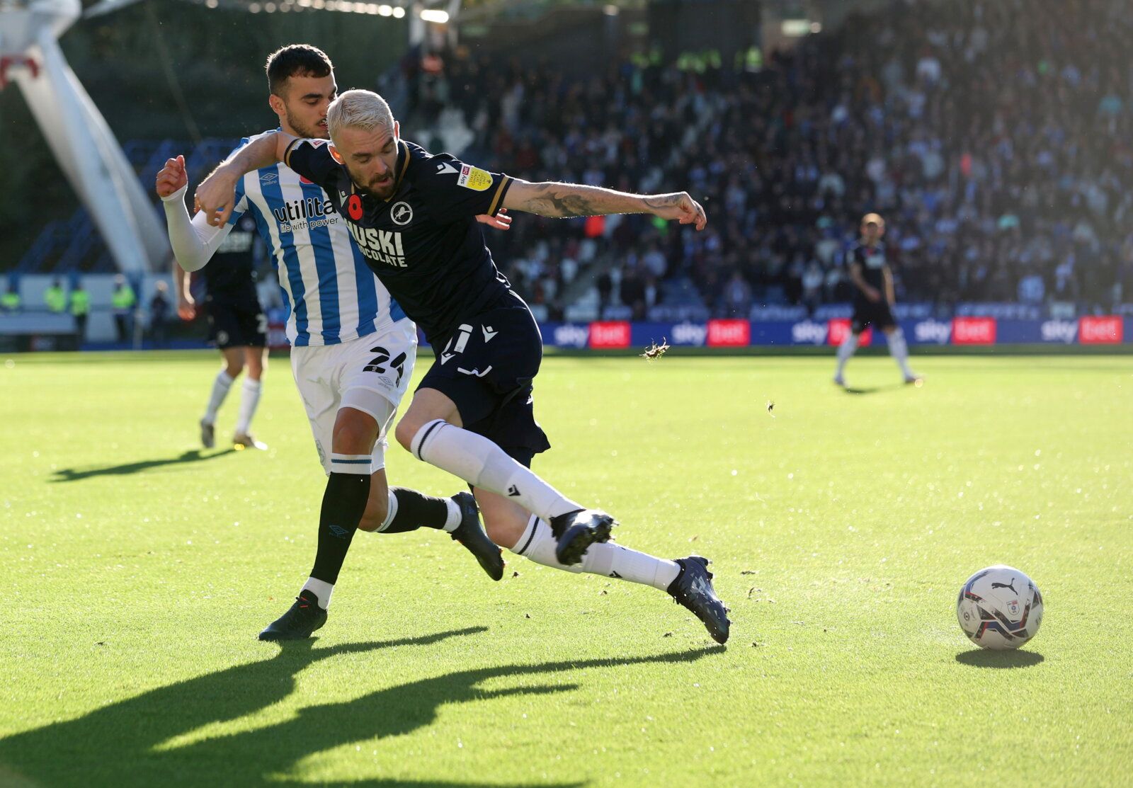 Soccer Football - Championship - Huddersfield Town v Millwall - John Smith's Stadium, Huddersfield, Britain - October 30, 2021 Millwall's Scott Malone in action with Huddersfield Town's Danel Sinani  Action Images/John Clifton  EDITORIAL USE ONLY. No use with unauthorized audio, video, data, fixture lists, club/league logos or 