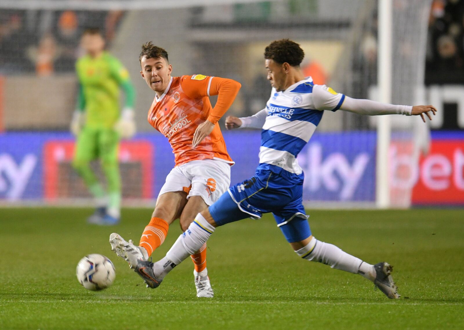 Soccer Football - Championship - Blackpool v Queens Park Rangers - Bloomfield Road, Blackpool, Britain - November 6, 2021 Blackpool's Ryan Wintle in action with QPR's Luke Amos  Action Images/Paul Burrows  EDITORIAL USE ONLY. No use with unauthorized audio, video, data, fixture lists, club/league logos or "live" services. Online in-match use limited to 75 images, no video emulation. No use in betting, games or single club/league/player publications.  Please contact your account representative fo