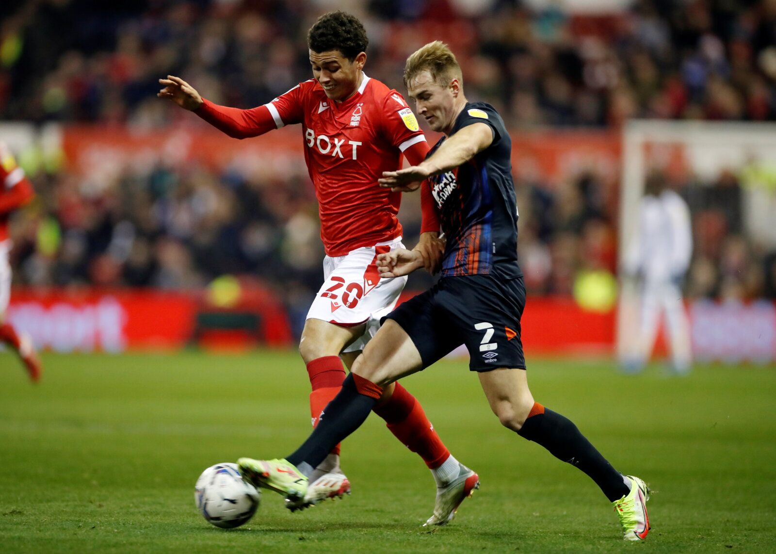 Soccer Football - Championship - Nottingham Forest v Luton Town - The City Ground, Nottingham, Britain - November 23, 2021 Nottingham Forest's Brennan Johnson in action with Luton Town's James Bree Action Images/Paul Childs