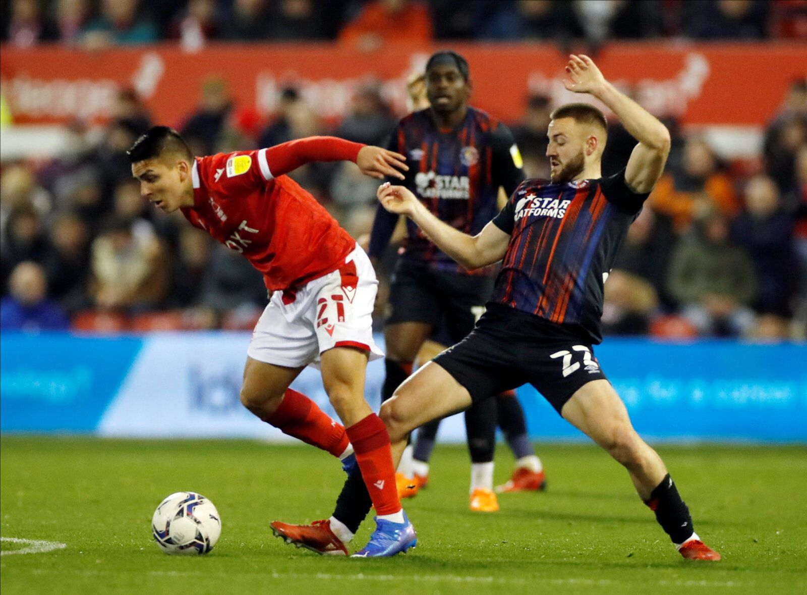 Soccer Football - Championship - Nottingham Forest v Luton Town - The City Ground, Nottingham, Britain - November 23, 2021 Nottingham Forest's Braian Ojeda in action with Luton Town's Allan Campbell Action Images/Paul Childs