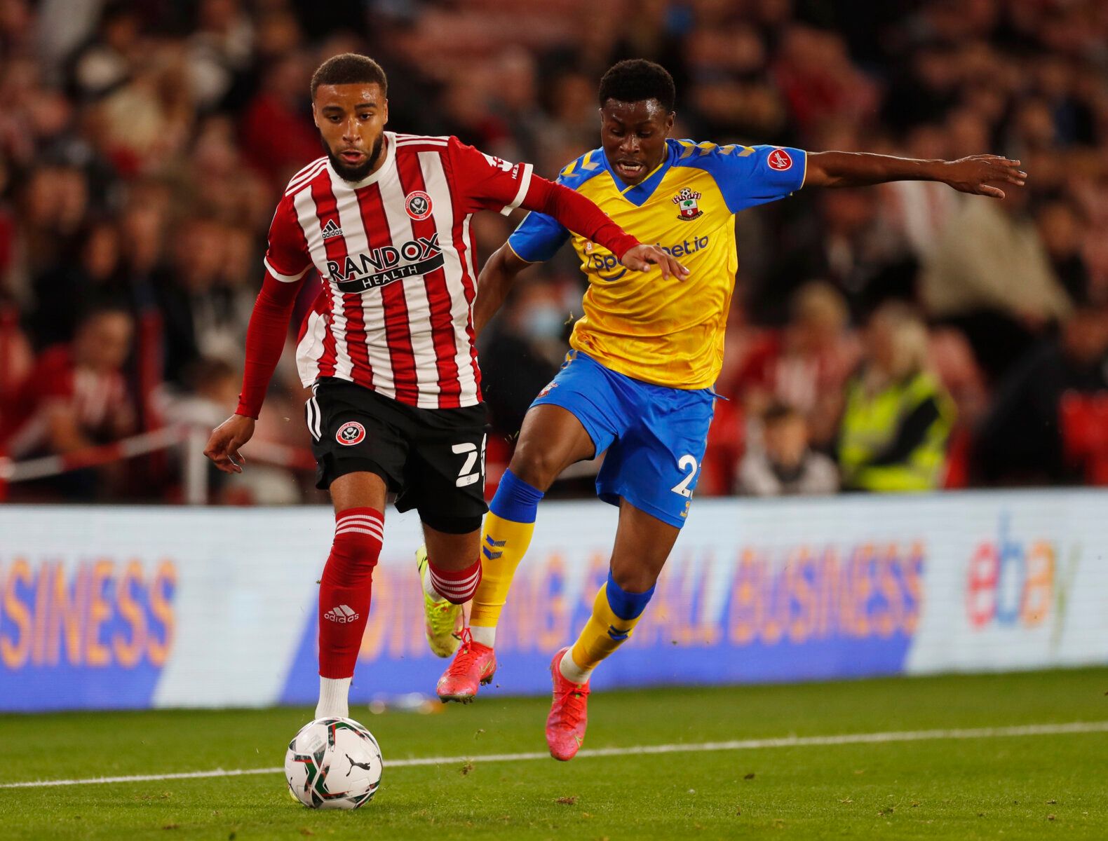 Soccer Football - Carabao Cup - Third Round - Sheffield United v Southampton - Bramall Lane, Sheffield, Britain - September 21, 2021 Sheffield United's Jayden Bogle in action with Southampton's Nathan Tella Action Images via Reuters/Lee Smith EDITORIAL USE ONLY. No use with unauthorized audio, video, data, fixture lists, club/league logos or 'live' services. Online in-match use limited to 75 images, no video emulation. No use in betting, games or single club /league/player publications.  Please 