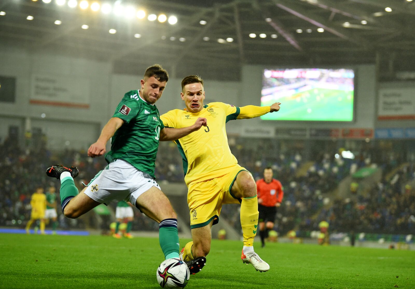 Soccer Football - World Cup - UEFA Qualifiers - Group C - Northern Ireland v Lithuania - Windsor Park, Belfast, Northern Ireland - November 12, 2021 Northern Ireland's Dale Taylor in action with Lithuania's Vytas Gaspuitis REUTERS/Clodagh Kilcoyne