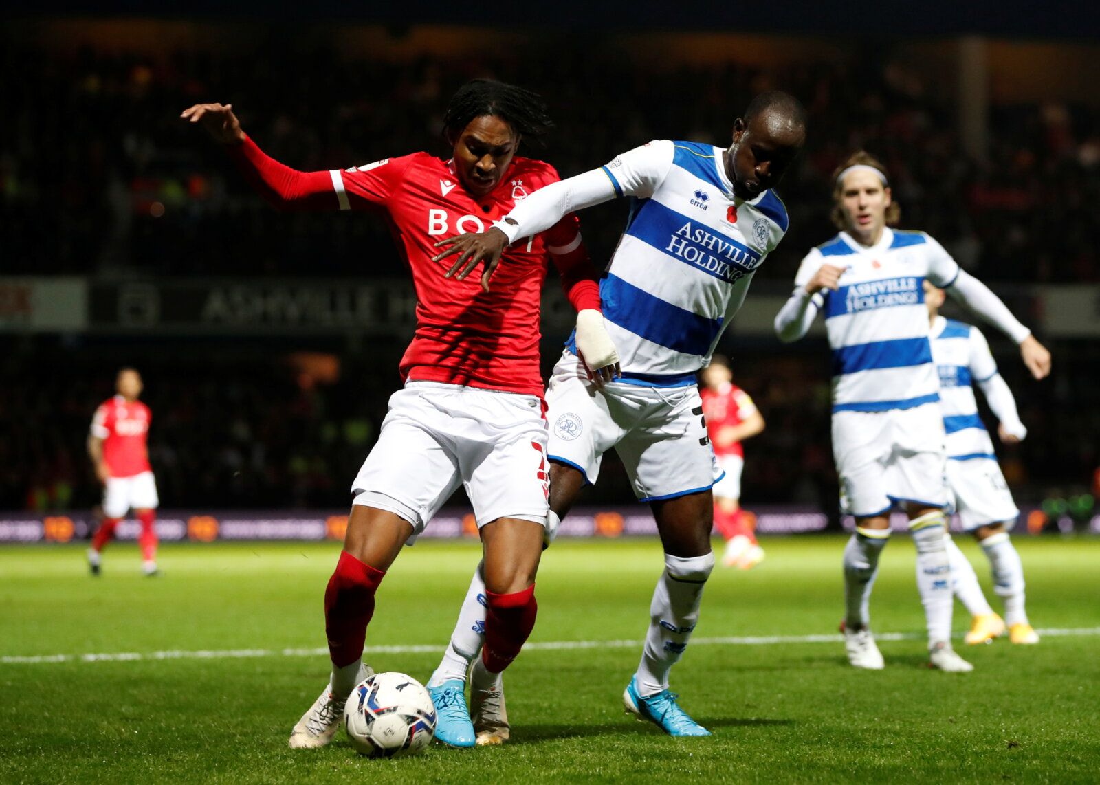 Soccer Football - Championship - Queens Park Rangers v Nottingham Forest - Loftus Road, London, Britain - October 29, 2021  Queens Park Rangers' Albert Adomah in action with Nottingham Forest's Djed Spence   Action Images/Paul Childs  EDITORIAL USE ONLY. No use with unauthorized audio, video, data, fixture lists, club/league logos or 