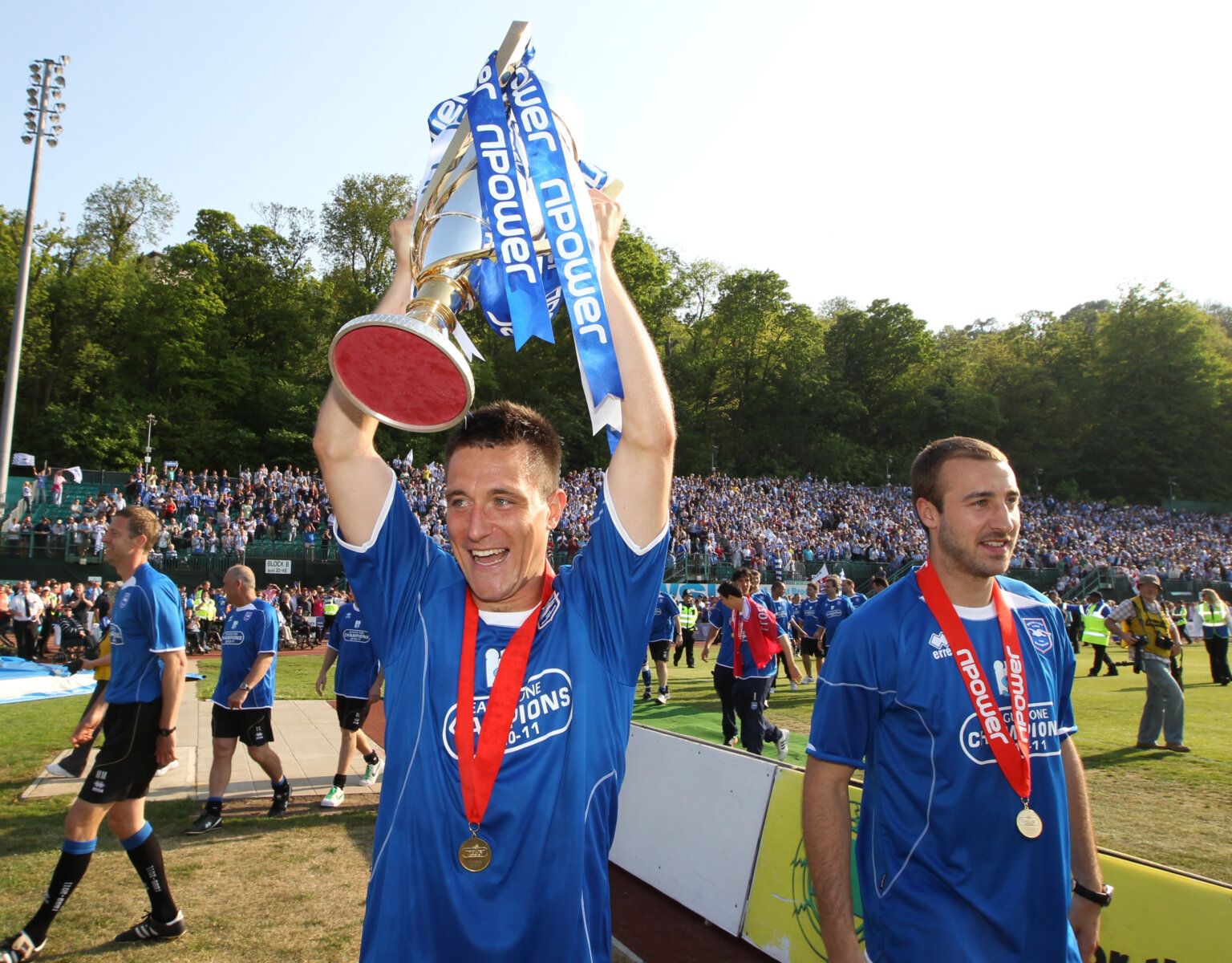 Football - Brighton &amp; Hove Albion v Huddersfield Town - npower Football League One - The Withdean Stadium - 10/11 - 30/4/11 
Marcos Painter - Brighton (C) celebrates winning League One with the trophy and promotion to the Championship 
Mandatory Credit: Action Images / Phil Cole