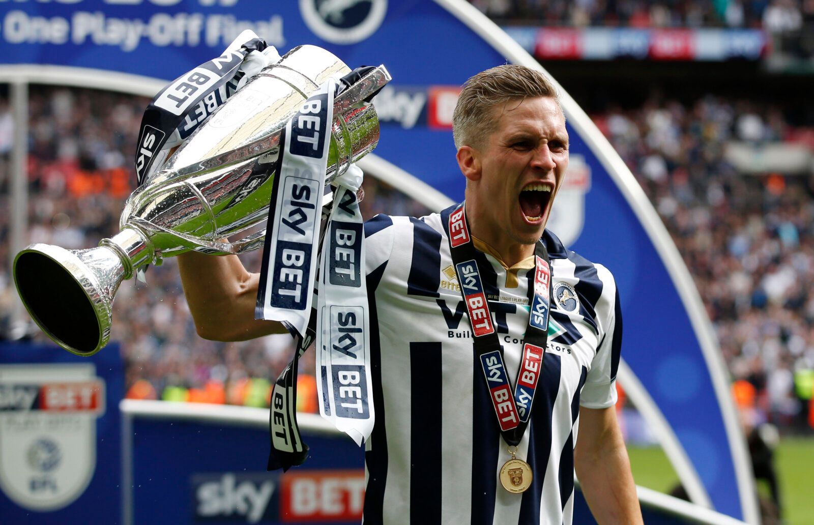 Britain Football Soccer - Bradford City v Millwall - Sky Bet League One Play-Off Final - Wembley Stadium, London, England - 20/5/17 Millwall's Steve Morison celebrates with the trophy after getting promoted to the Sky Bet Championship  Mandatory Credit: Action Images / Peter Cziborra Livepic EDITORIAL USE ONLY. No use with unauthorized audio, video, data, fixture lists, club/league logos or 